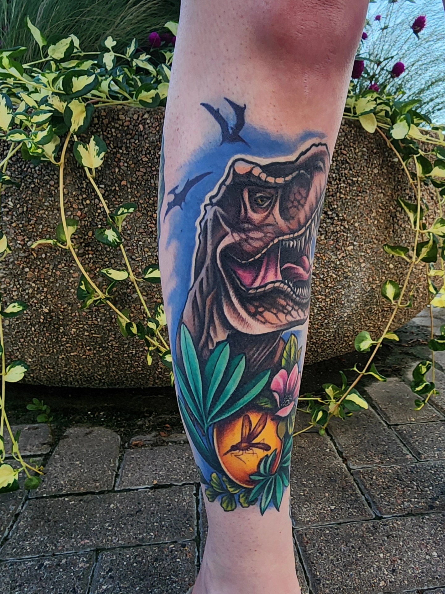 T-Rex American traditional tattoo on the forearm by Shawna Goettsche