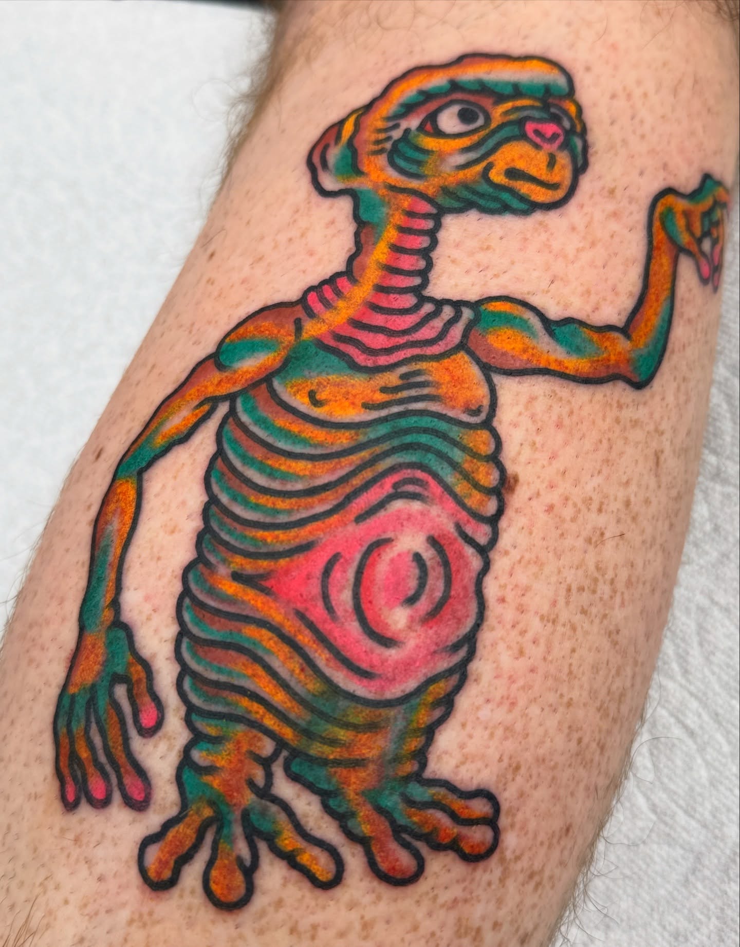 Alien skeleton American traditional tattoo on the thigh by Joey Burdette Tattoos