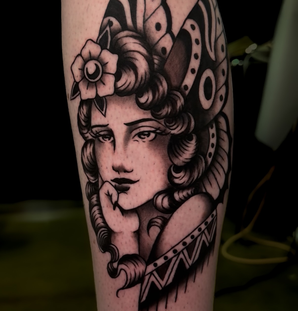 Woman with flower crown American traditional tattoo on the forearm by Cory Allen