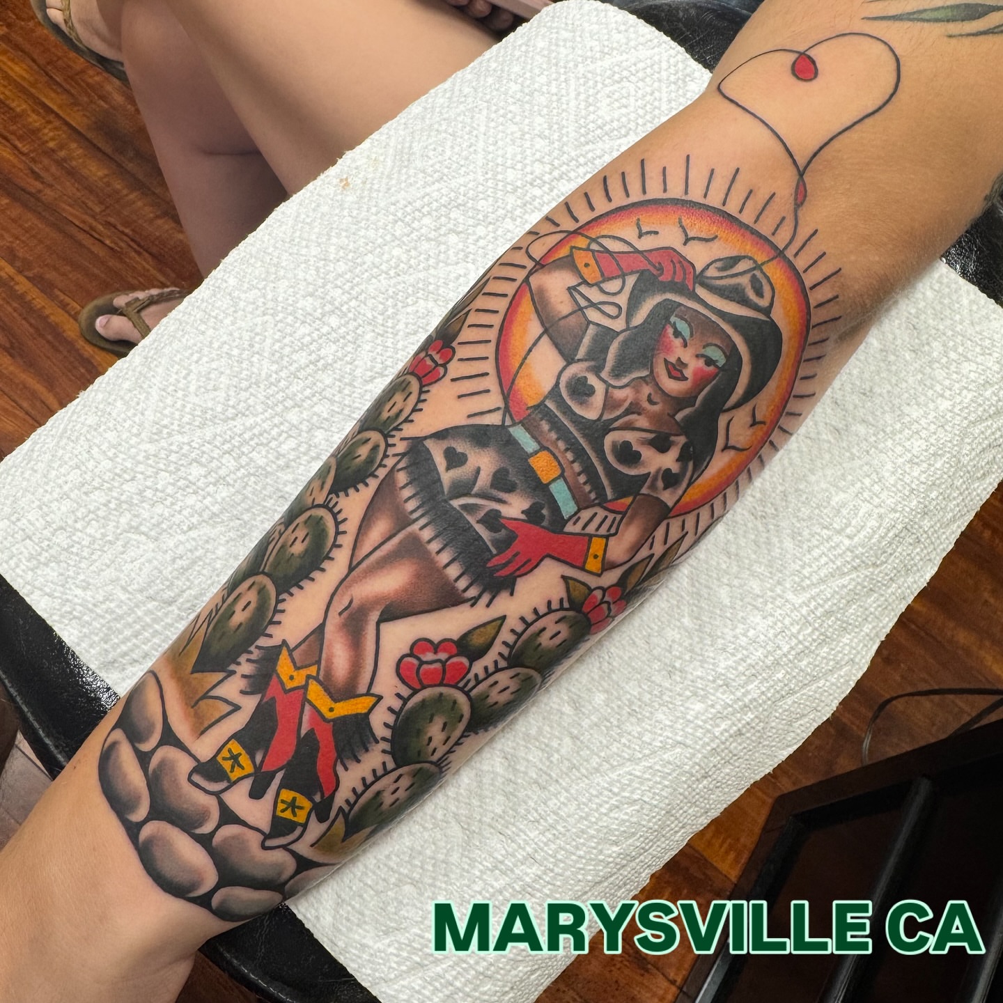 Woman with cacti American traditional tattoo on the forearm by Rogelio Robles