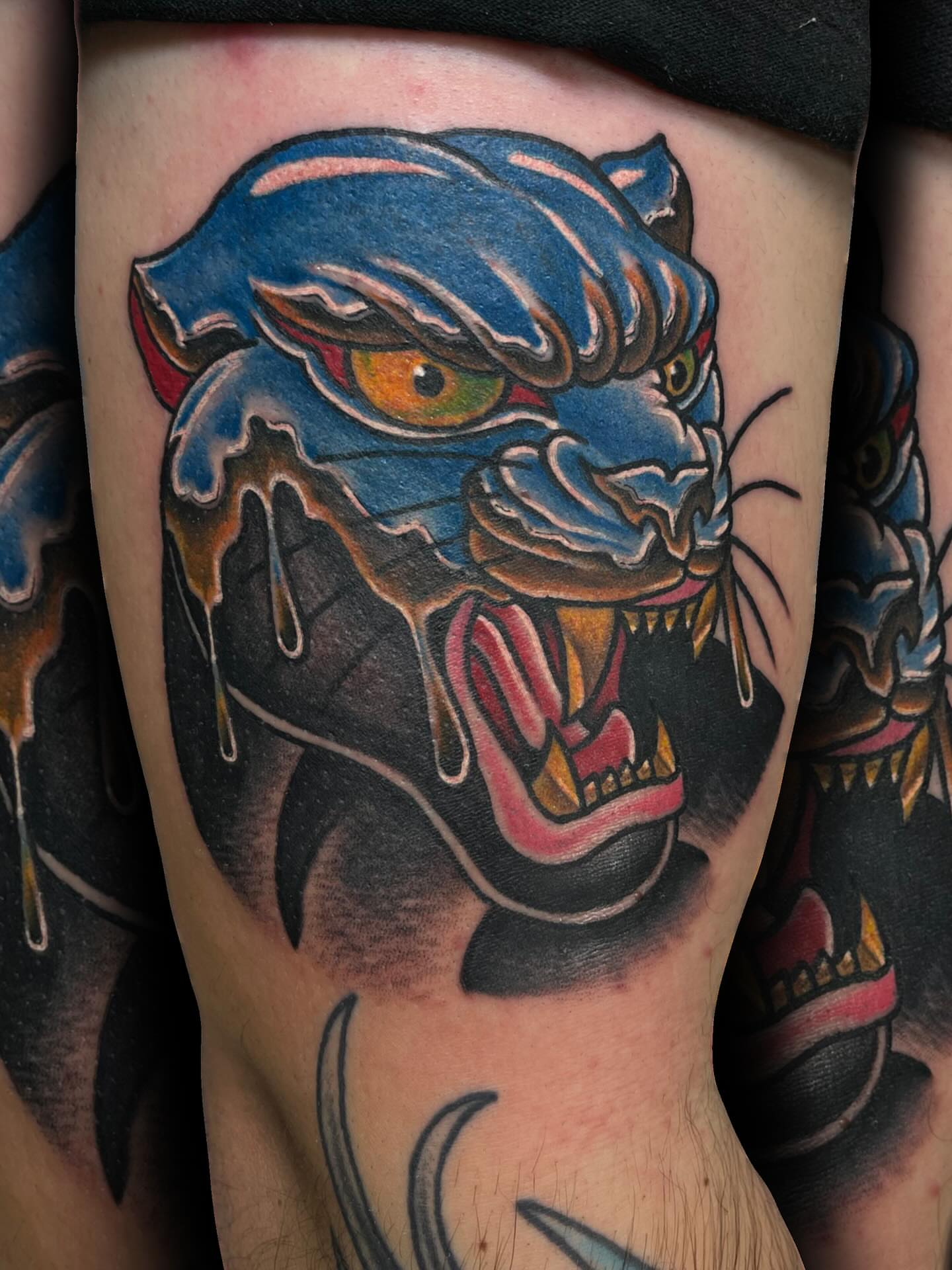 Blue panther American traditional tattoo on the thigh by ᴄʜʀɪs ᴀᴠᴇʀᴀ