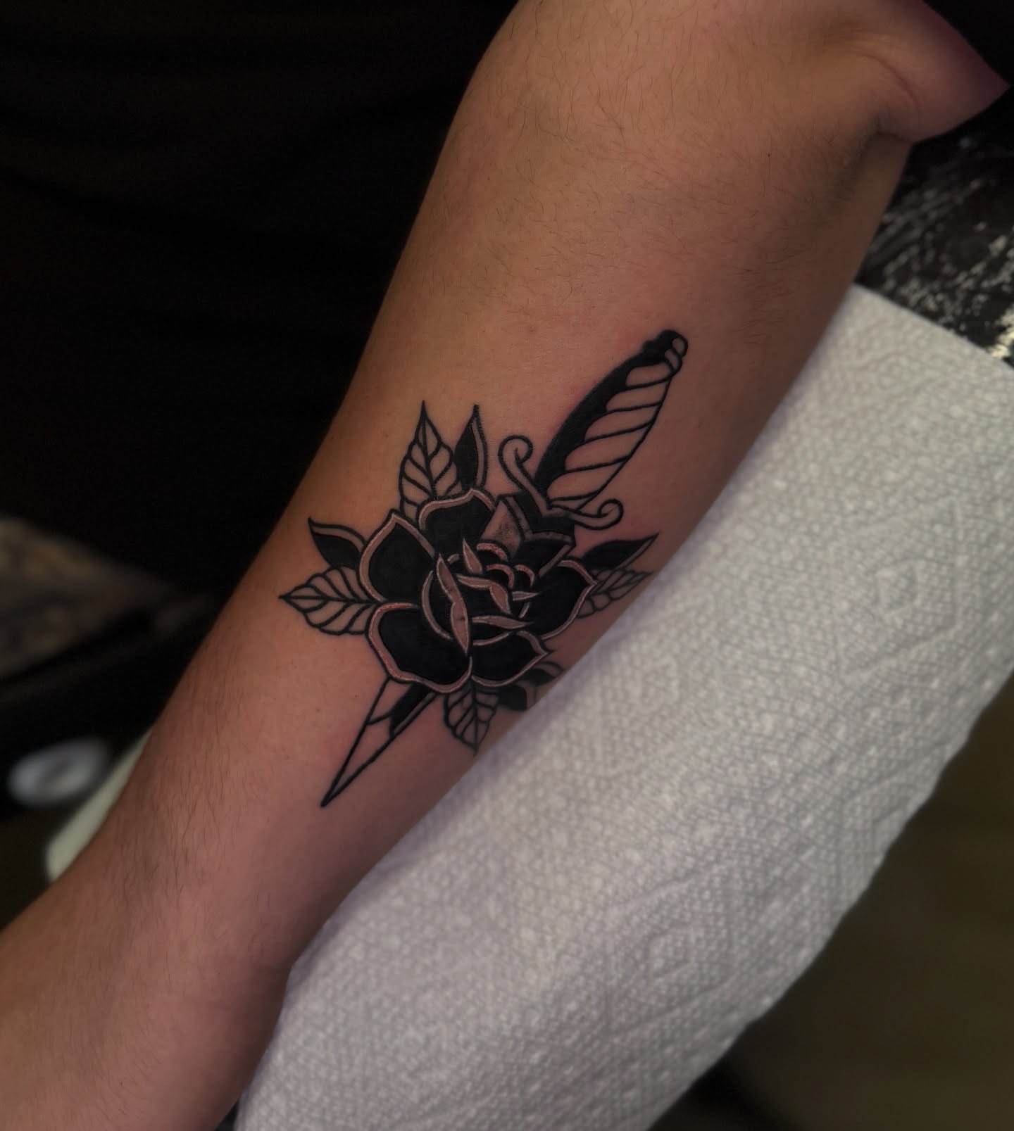 Rose and dagger black and grey tattoo on the forearm by Preston-NJ Tattoo Artist