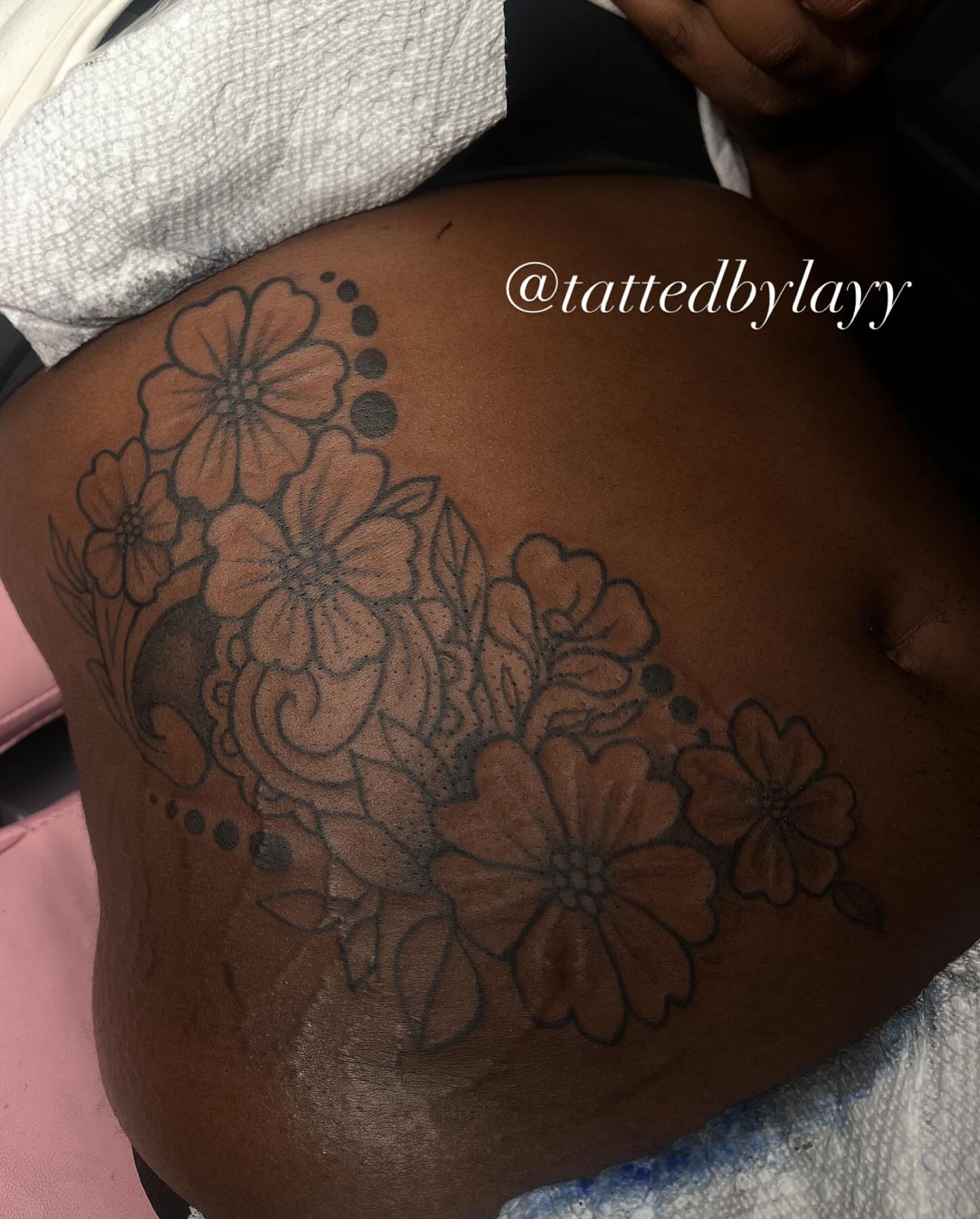 Floral bouquet dotwork tattoo on the thigh by Tatted By Layy