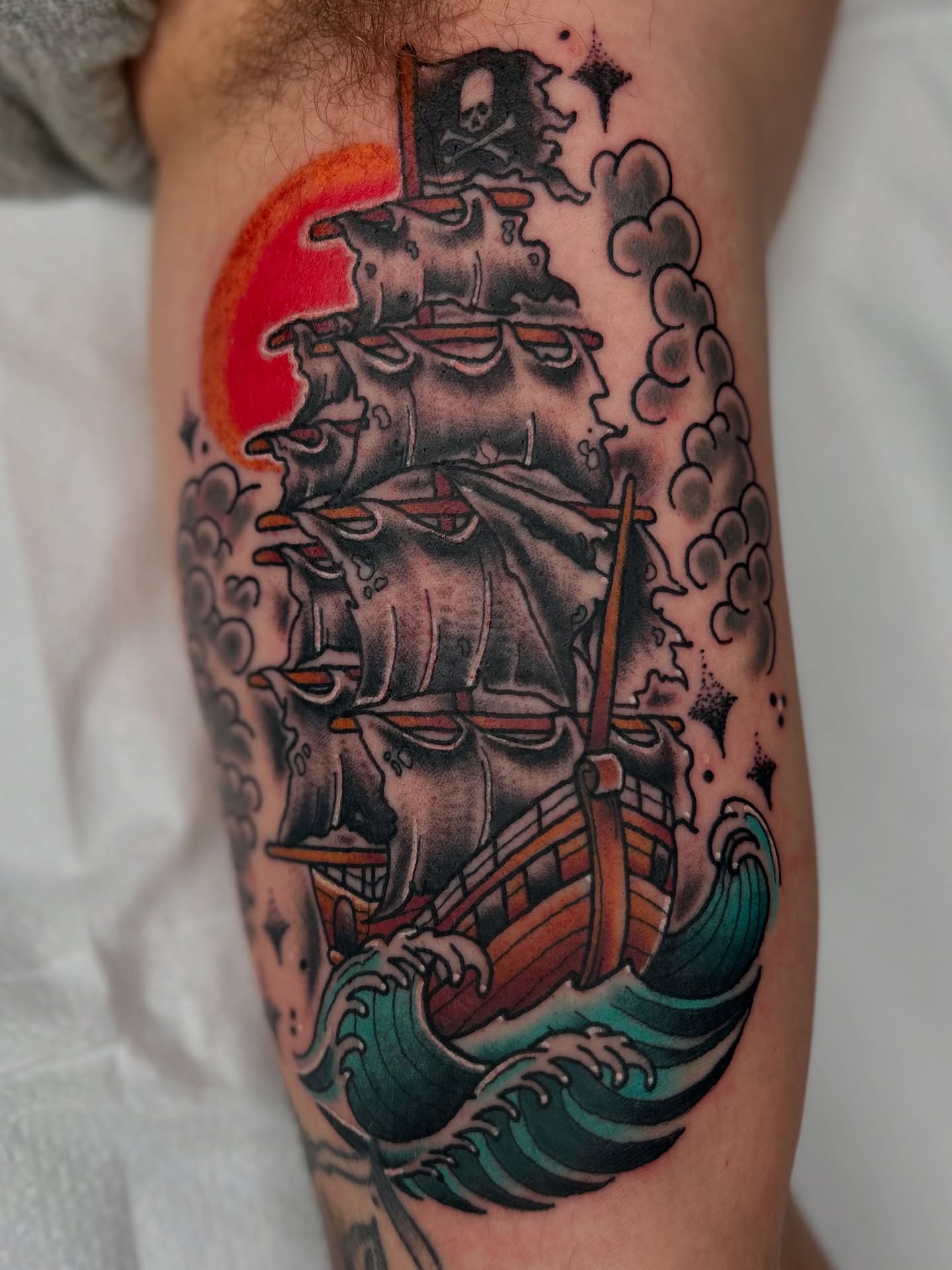 Pirate ship American traditional tattoo on the forearm by Noah Crow