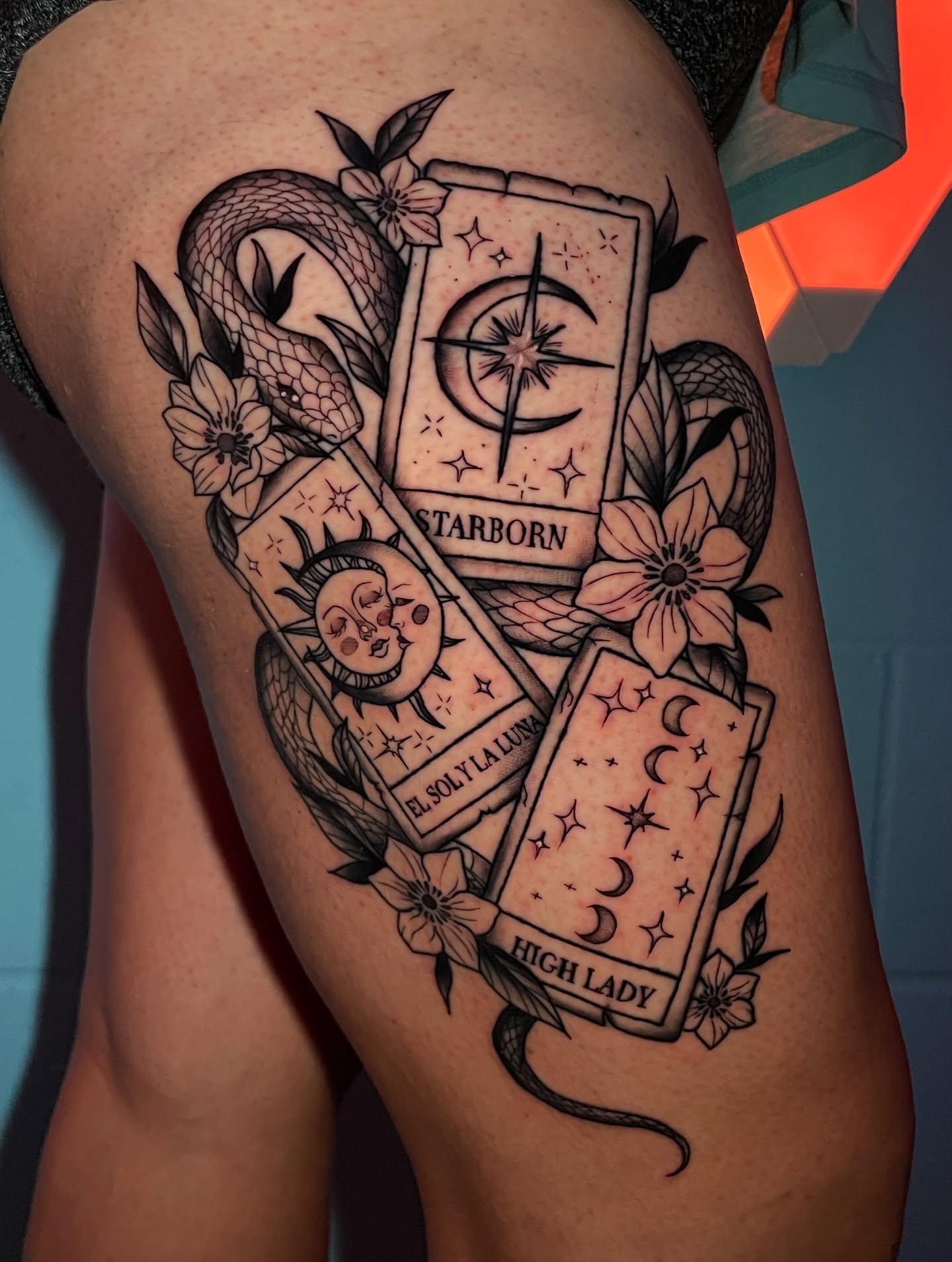 Tarot cards and celestial symbols black and grey tattoo on the thigh by Marie π Tattoos