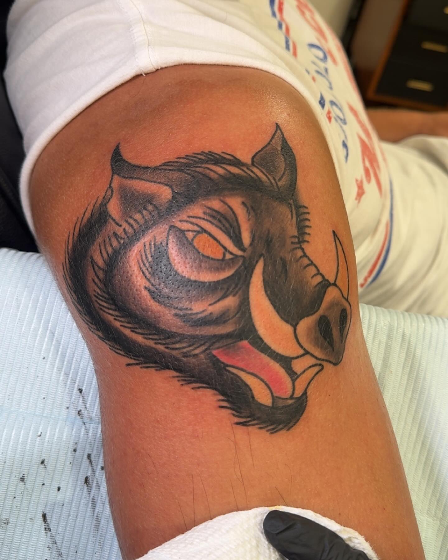 Boar head realism tattoo on the thigh by Robbie Roberson