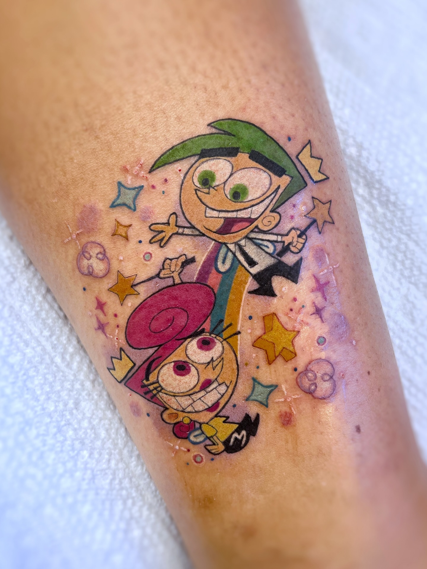 Two cartoon characters new school tattoo on the forearm by sam cedar geller 🐝