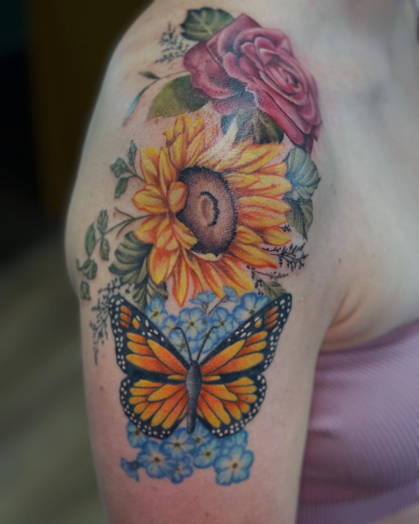 Sunflower and butterfly realism tattoo on the shoulder by Tina Gregg, North Ridgeville, Ohio