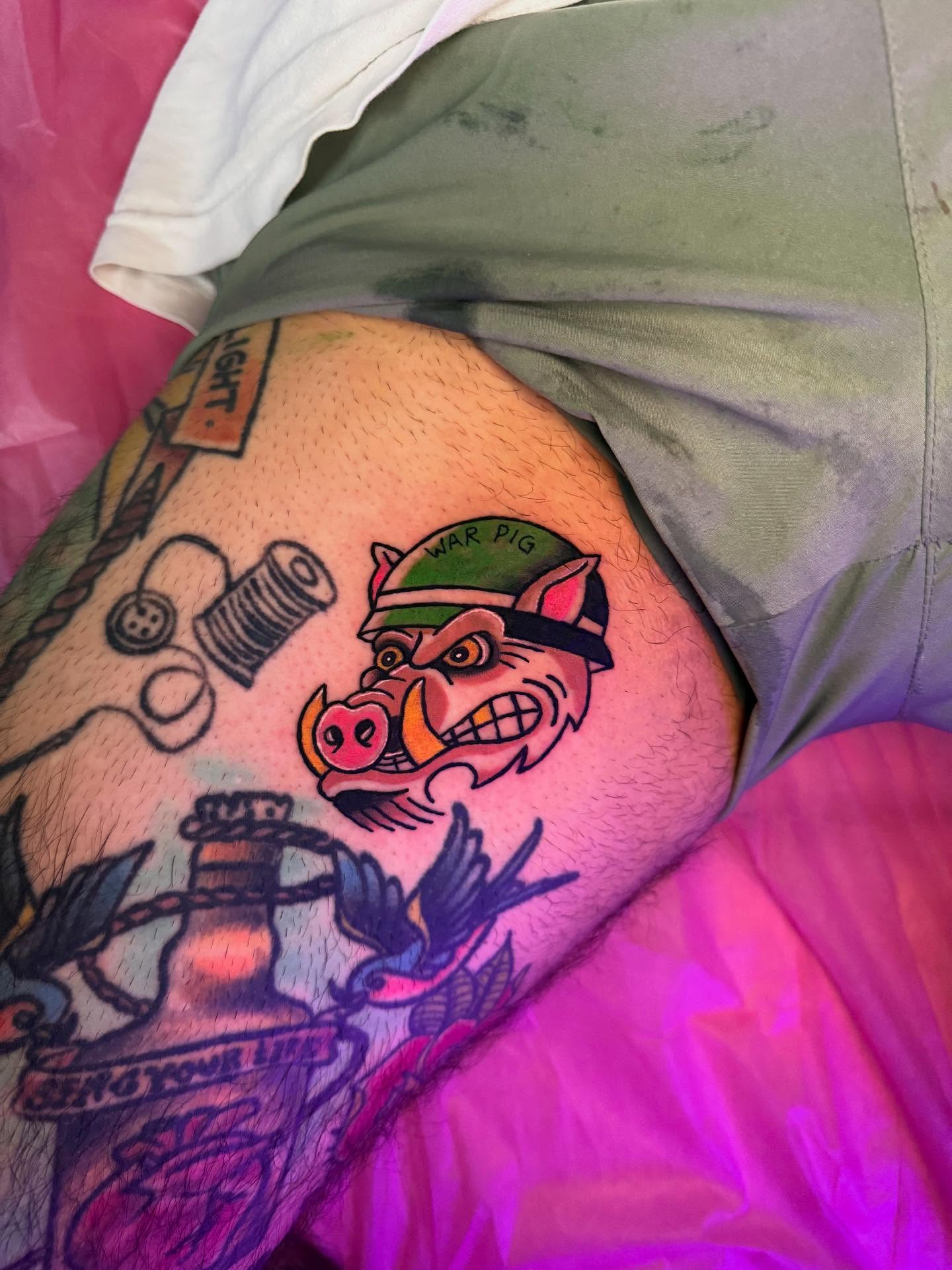 War pig American traditional tattoo on the thigh by Jasmin Lozano