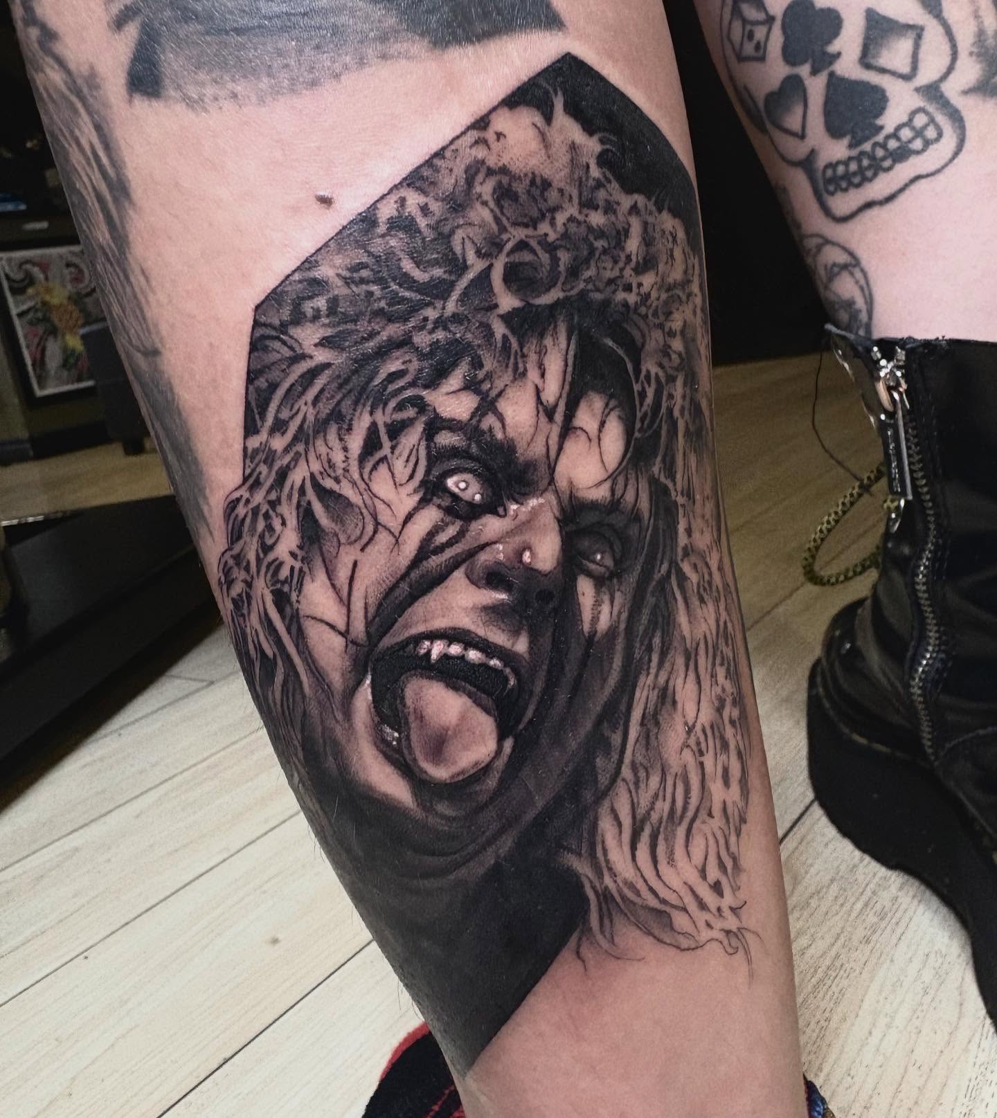Horror clown realism tattoo on the forearm by Tad Fulkerson, San Francisco, California
