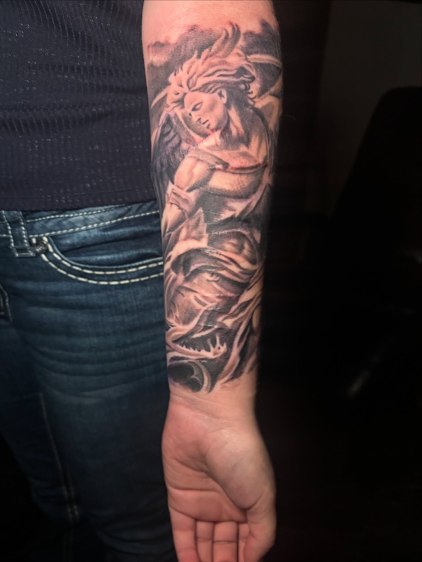 Angelic figure realism tattoo on the forearm by Eric Garcia