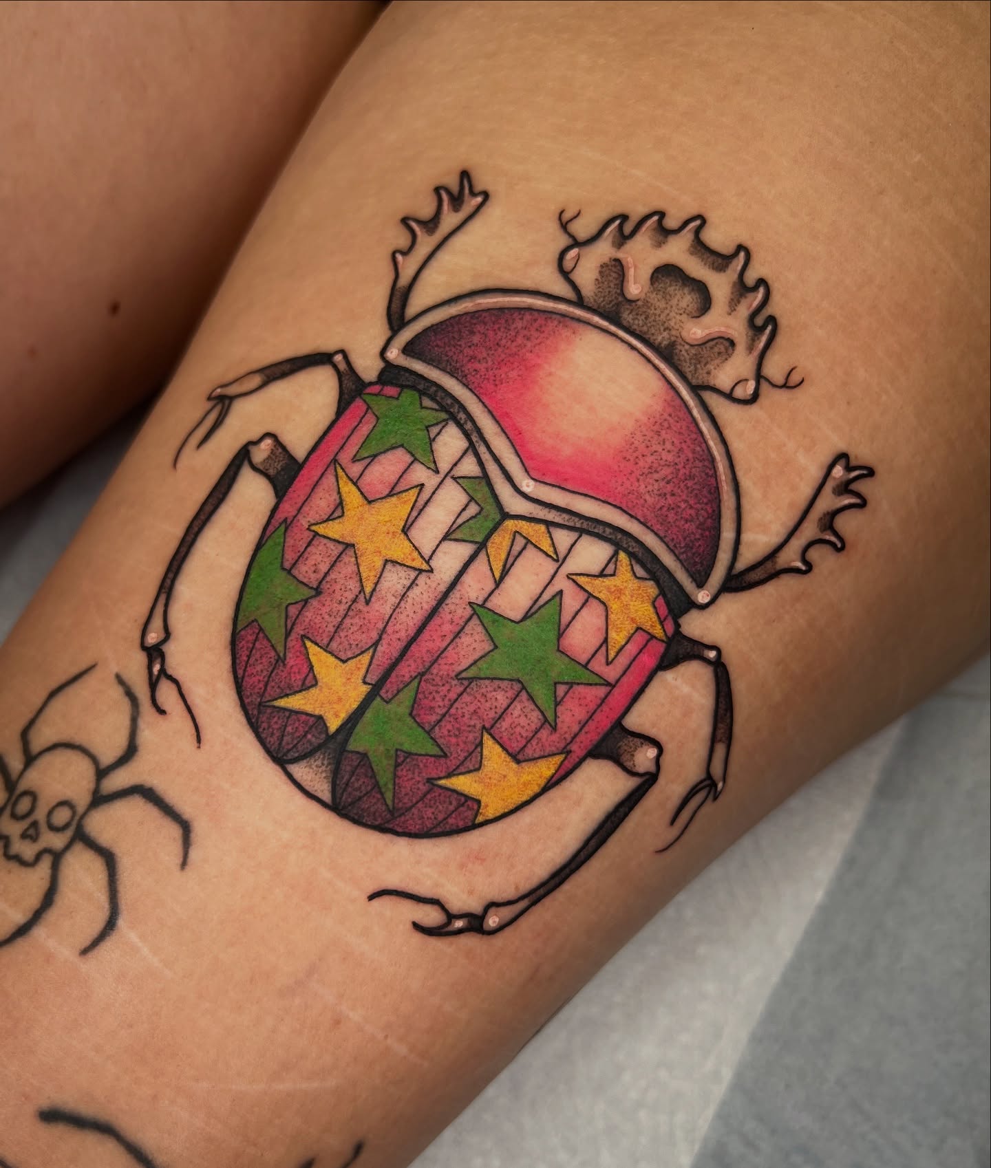 Scarab beetle geometric tattoo on the thigh by 𝔓𝔢𝔞𝔠𝔥𝔶 𝔄𝔫𝔰𝔩𝔢𝔶