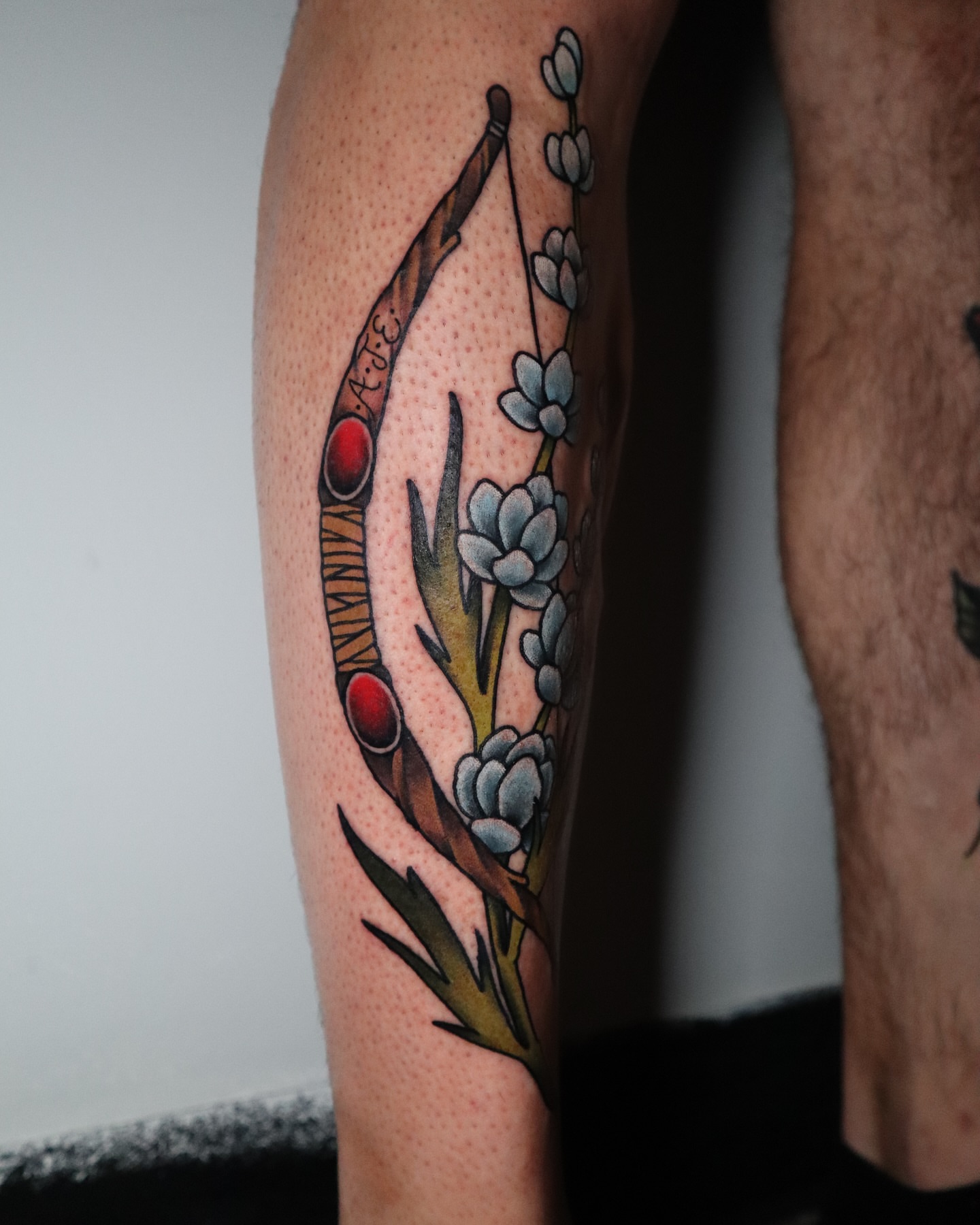 Flower and berries American traditional tattoo on the forearm by Lauren Howard Tattoos