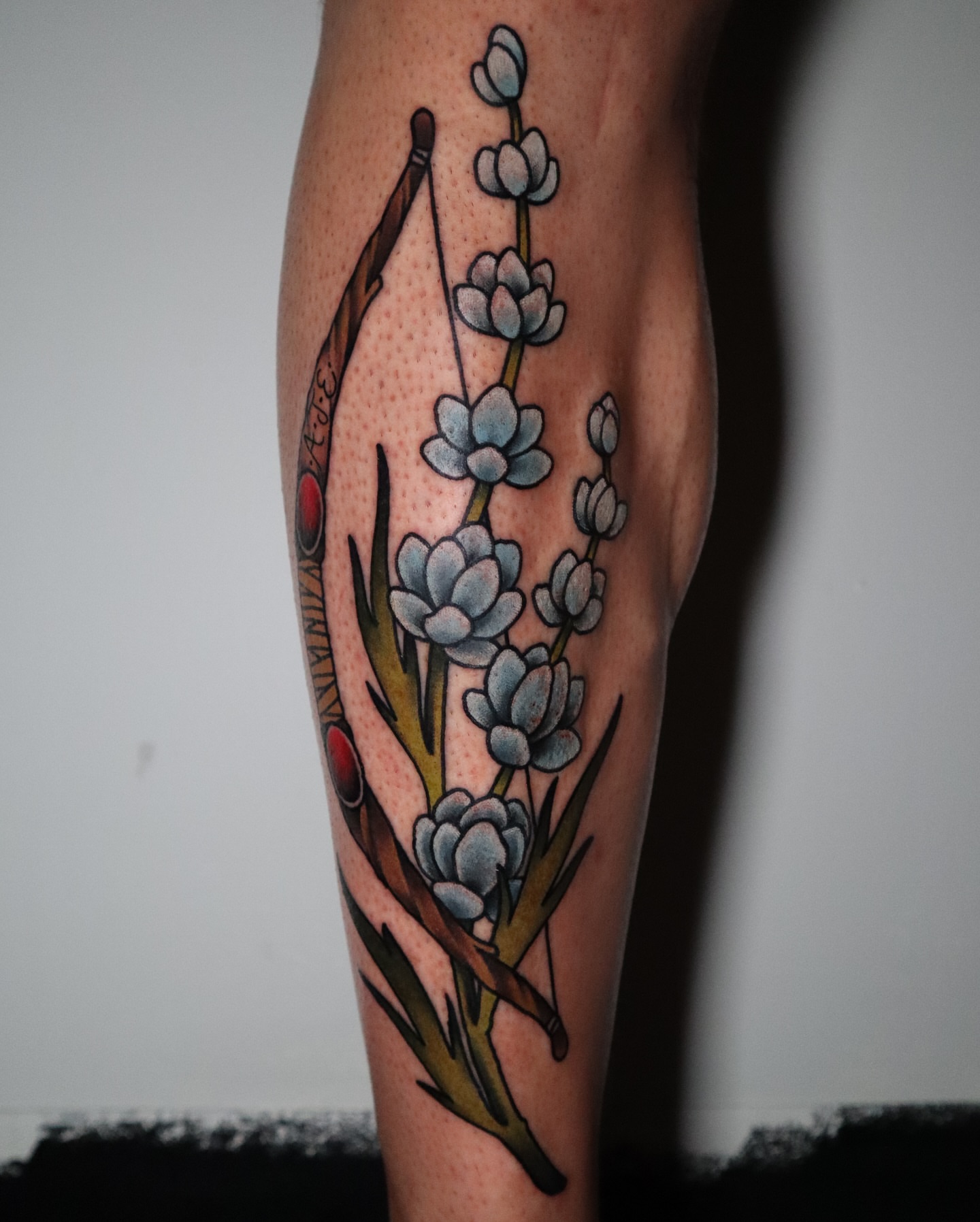Flower bouquet American traditional tattoo on the forearm by Lauren Howard Tattoos