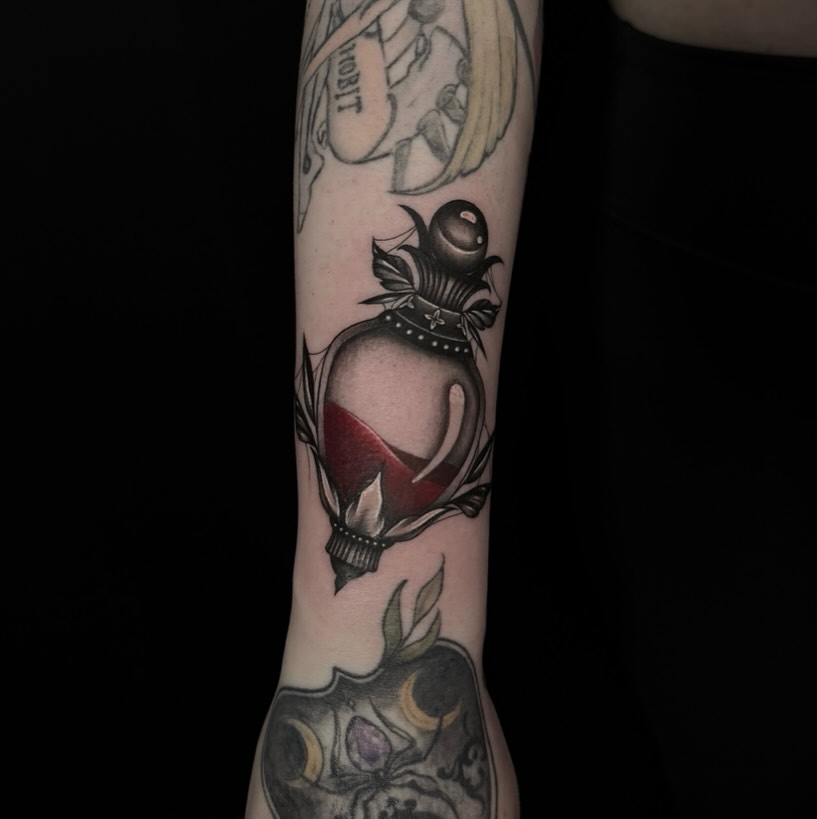 Heart with flame neo-traditional tattoo on the forearm by Desirae✨