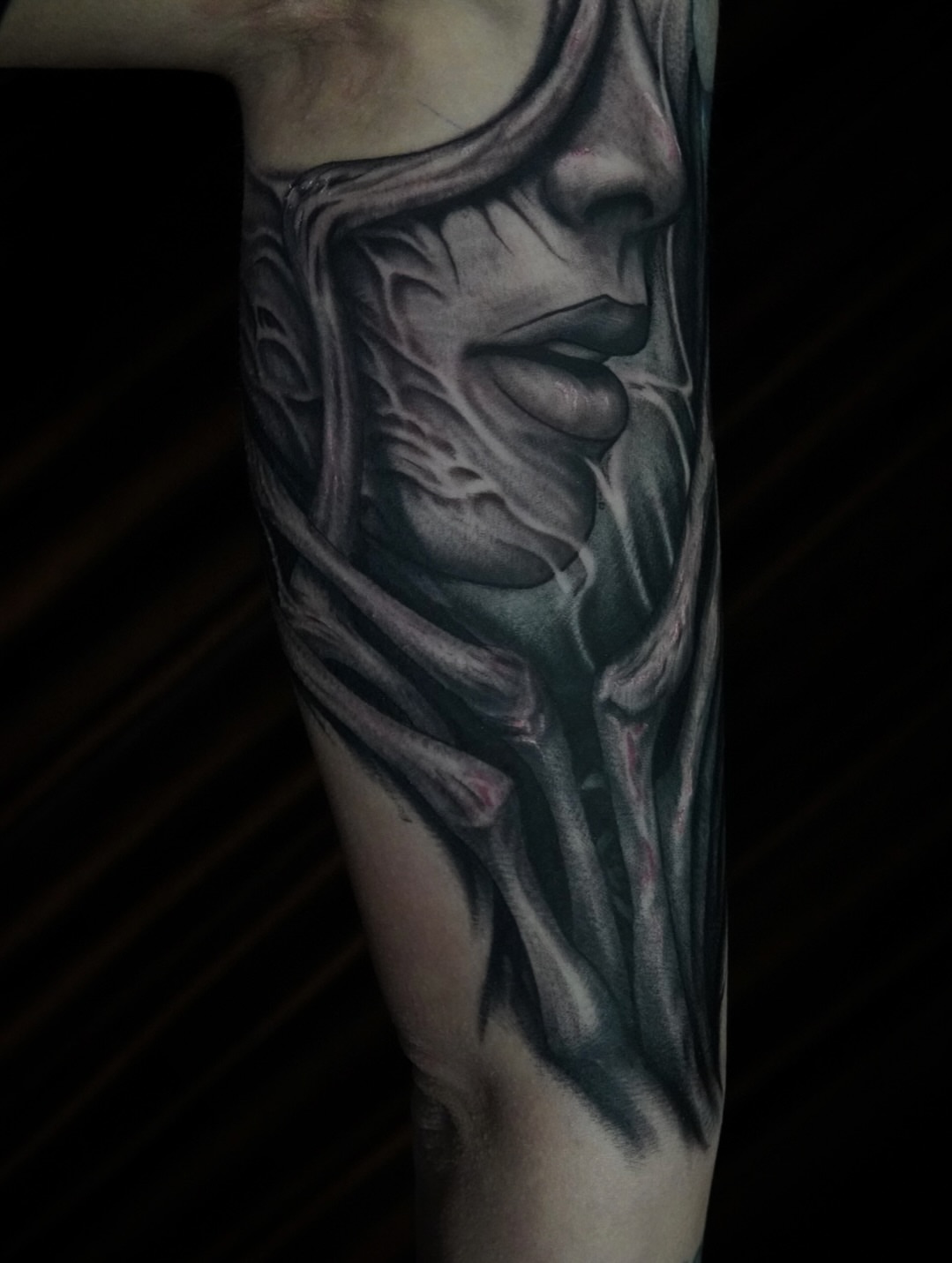 Abstract face realism tattoo on the forearm by 𝕭𝖗𝖞𝖈𝖊 𝖂𝖎𝖑𝖑𝖎𝖆𝖒