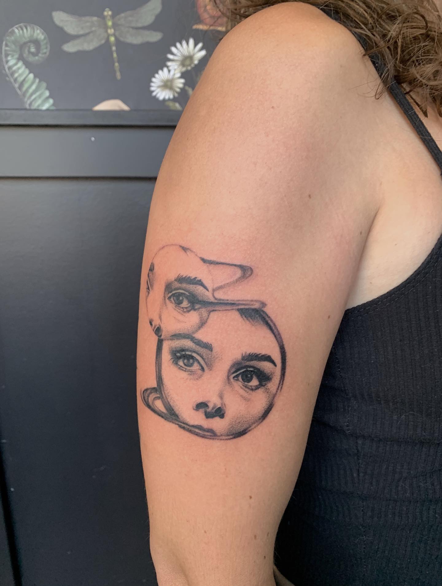 Woman's face realism tattoo on the upper arm by Jess, Midvale, Utah