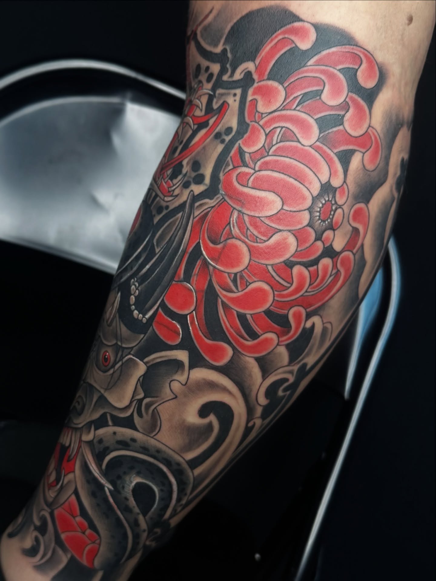 Chrysanthemum and samurai helmet japanese irezumi tattoo on the forearm by Rachel Martinez