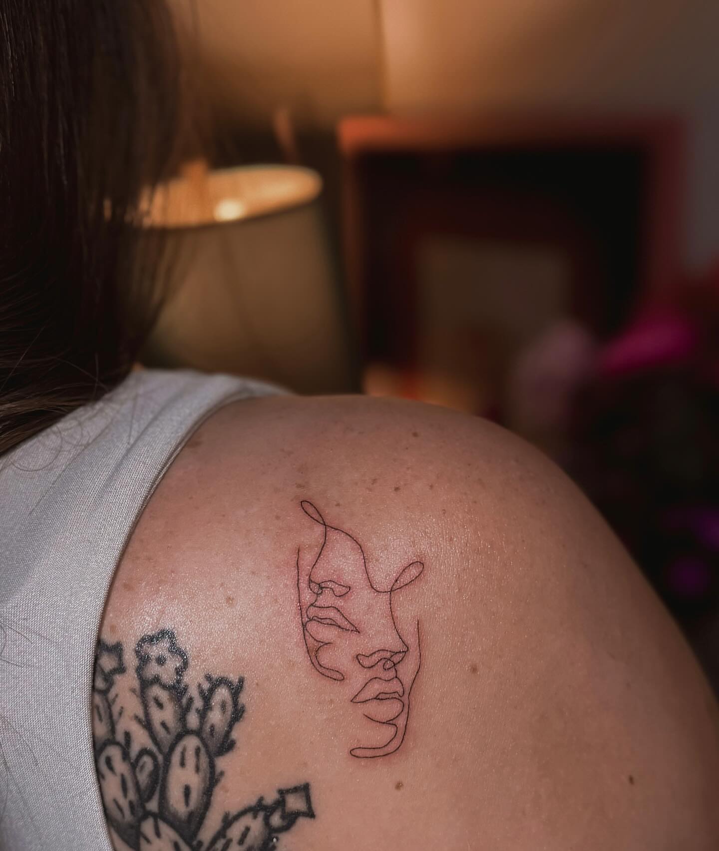 Abstract face fine line tattoo on the shoulder by π»ππ π
ππππ Tattoo Artist, Las Vegas, Nevada