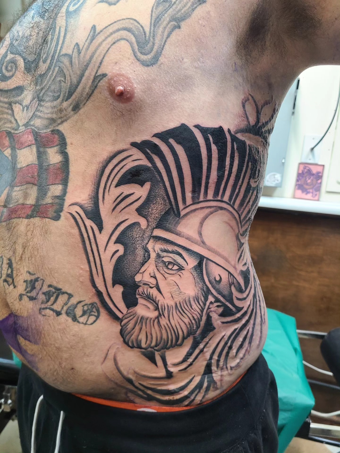 Bearded warrior black and grey tattoo on the chest by David Vodicka