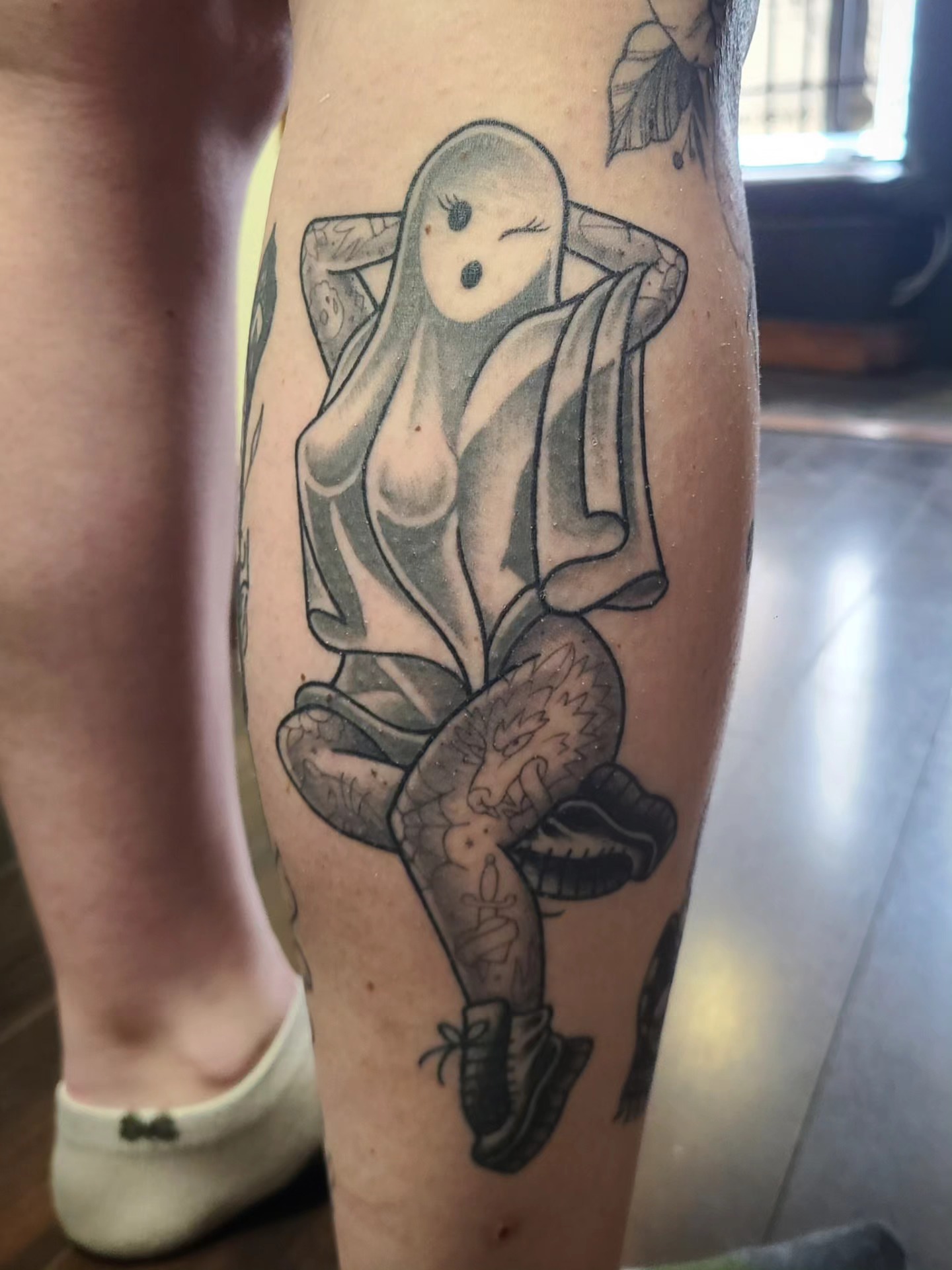 Female figure black and grey tattoo on the leg by David Vodicka