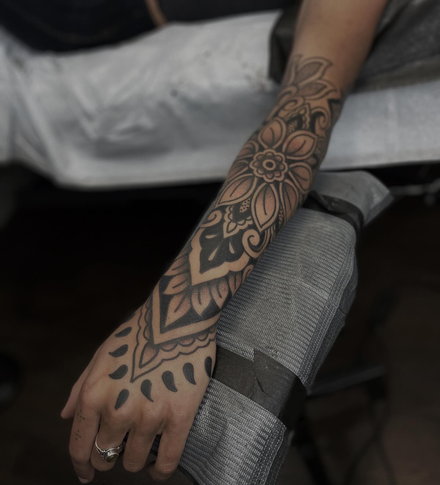 Floral mandala geometric tattoo on the forearm by Veronica