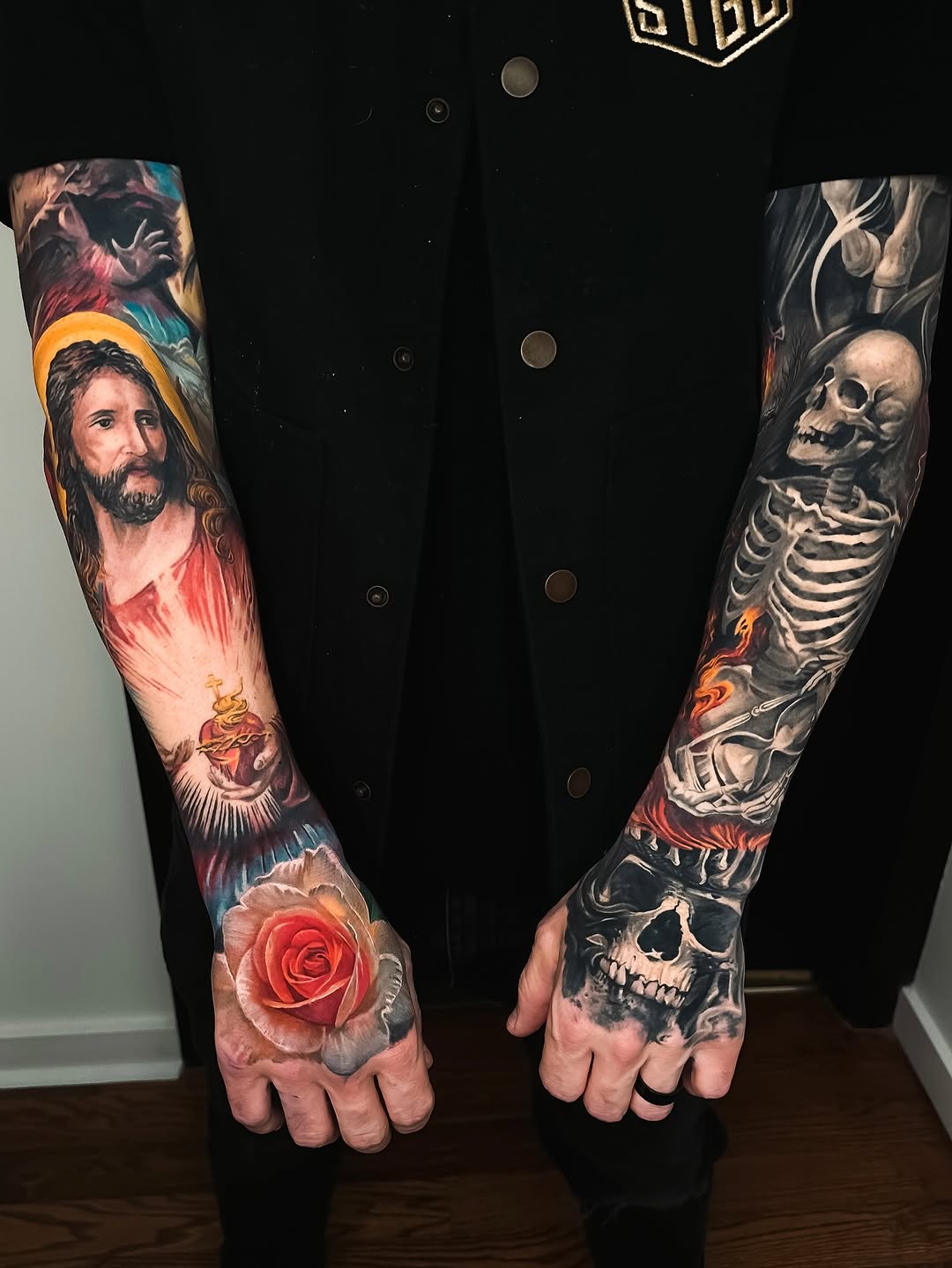 Jesus, skeleton, rose, and skull dark art tattoo on the forearm by angel.antonio.tattoos