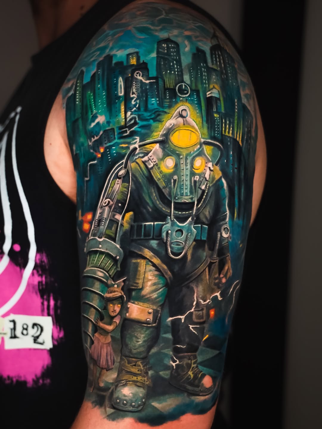 Surrealism tattoo on the upper arm by angel.antonio.tattoos