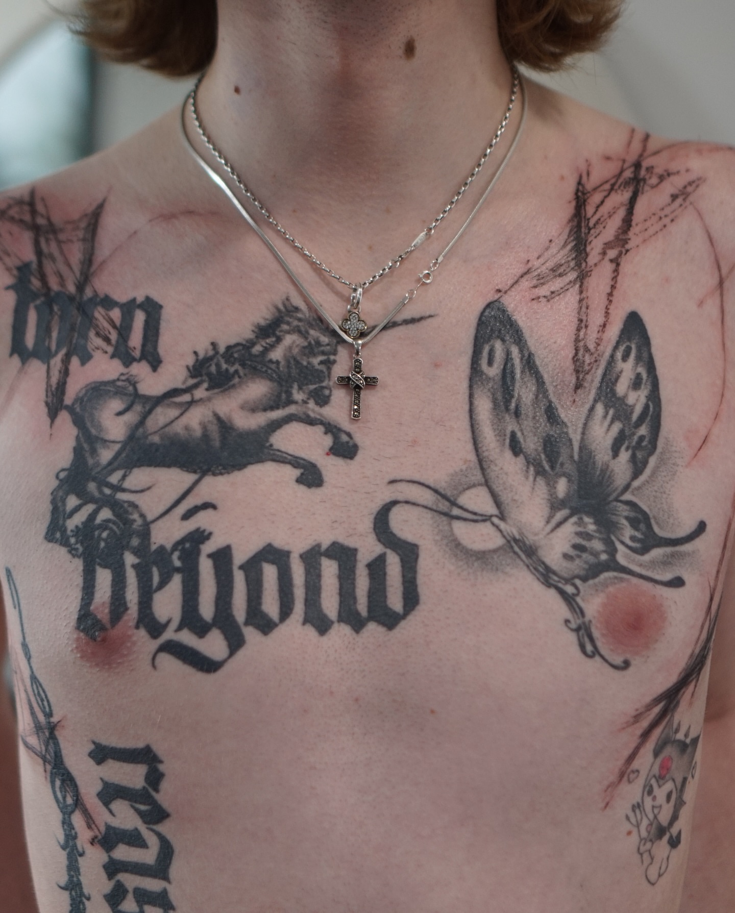 Horse and butterfly realism tattoo on the chest by Young one 영원