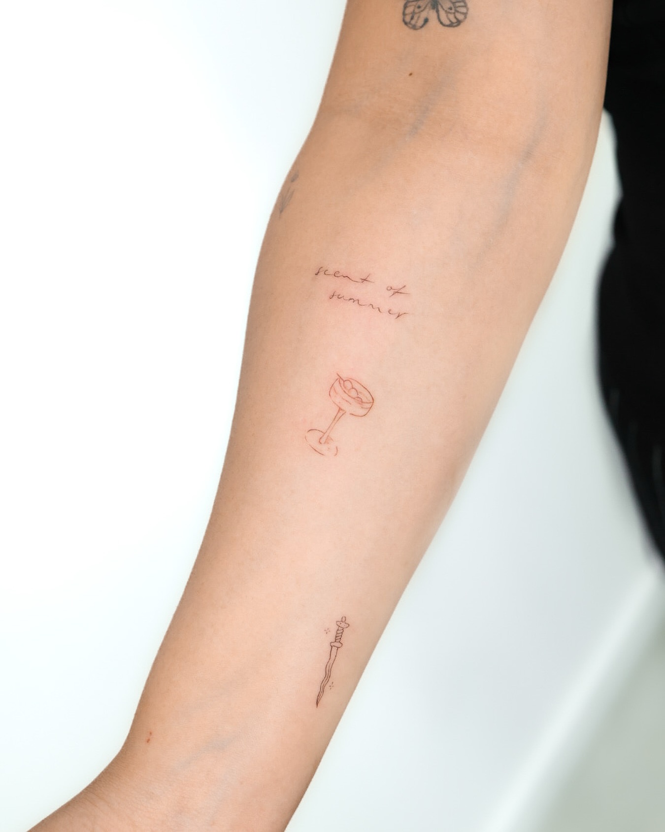 Summer drink fine line tattoo on the forearm by Fine Line, New York, New York