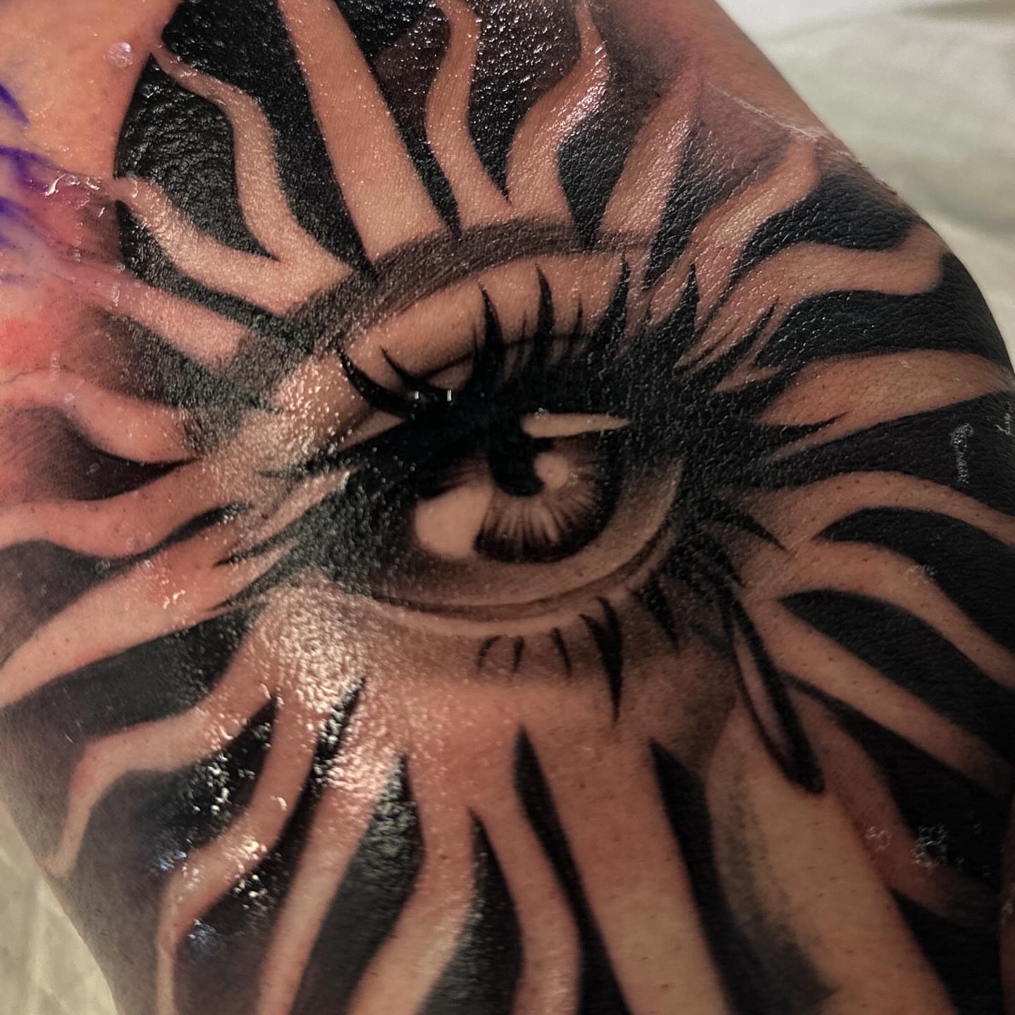 Eye realism tattoo on the forearm by audi