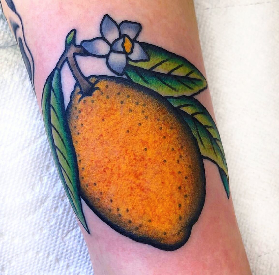 Orange fruit dotwork tattoo on the forearm by Randy Conner, Portland, Oregon