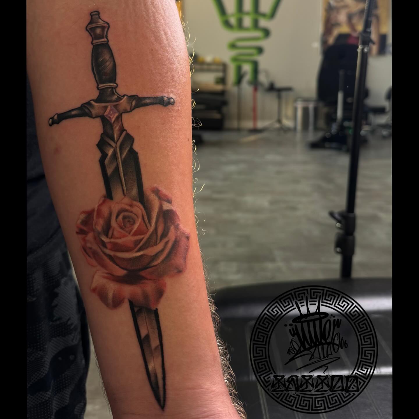 Sword and rose realism tattoo on the forearm by Lu Ve, Dayton, Ohio