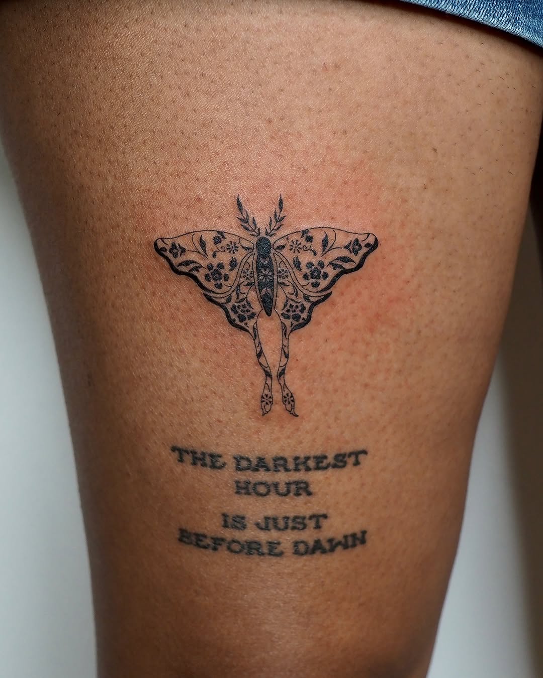 Moth and quote fine line tattoo on the thigh by A. Eye Tat