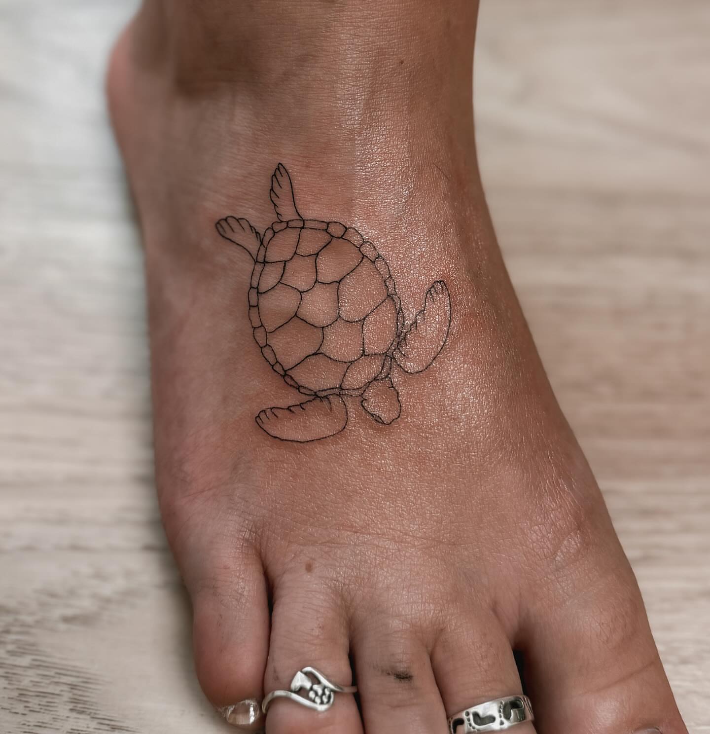 Turtle geometric tattoo on the foot by π»ππ π
ππππ Tattoo Artist, Las Vegas, Nevada