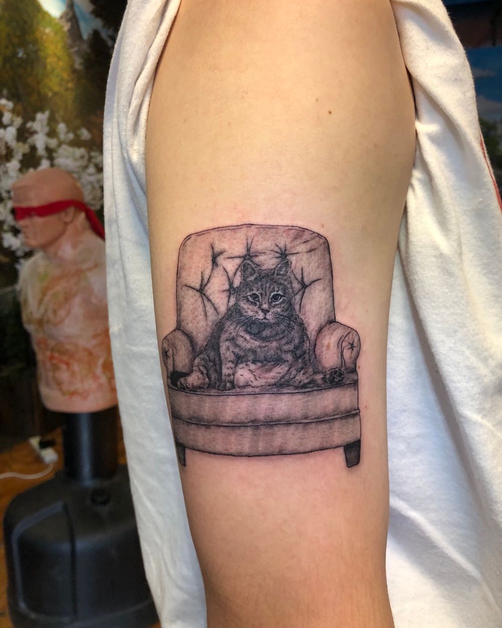 Cat in chair realism tattoo on the forearm by Lake Stephens, Richmond, Virginia