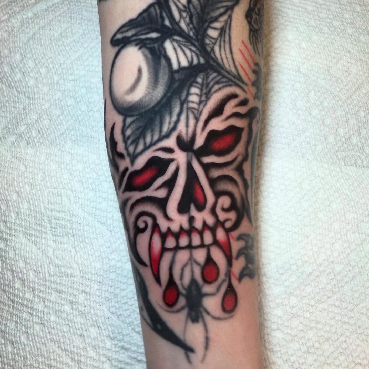 Skull American traditional tattoo on the forearm by Julia Louise