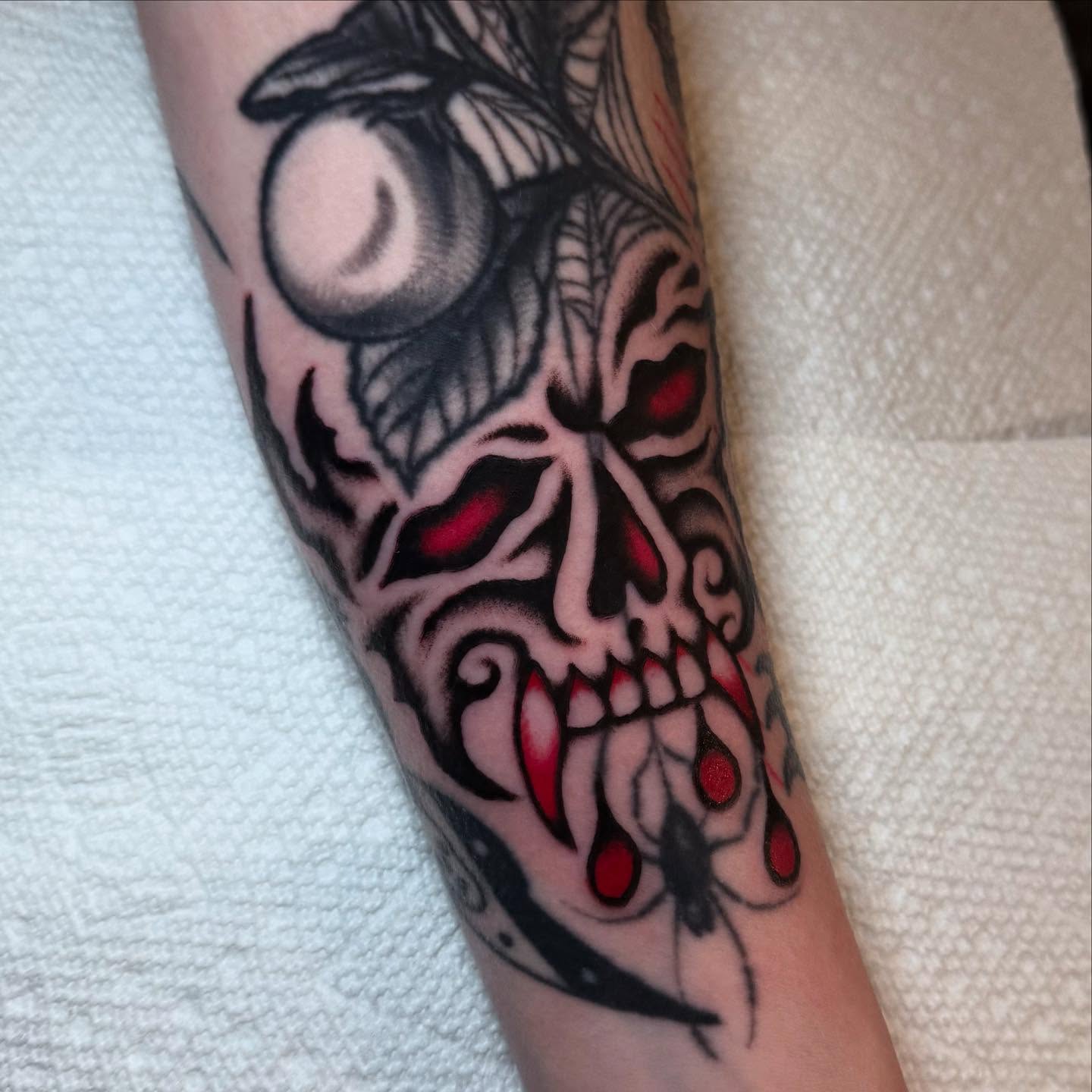 Skull dark realism tattoo on the forearm by Julia Louise