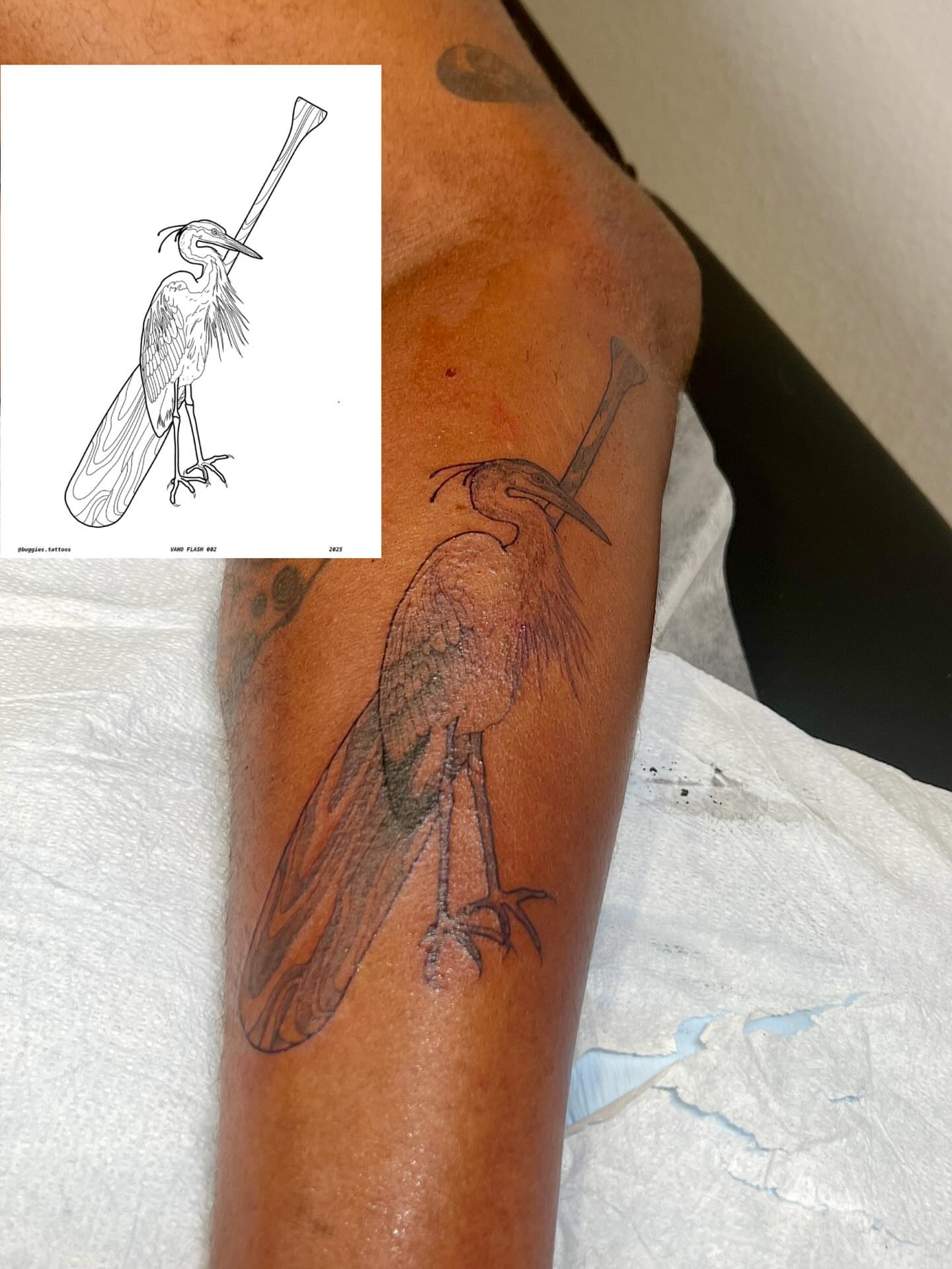 Heron with bat black and grey tattoo on the forearm by sarah bug