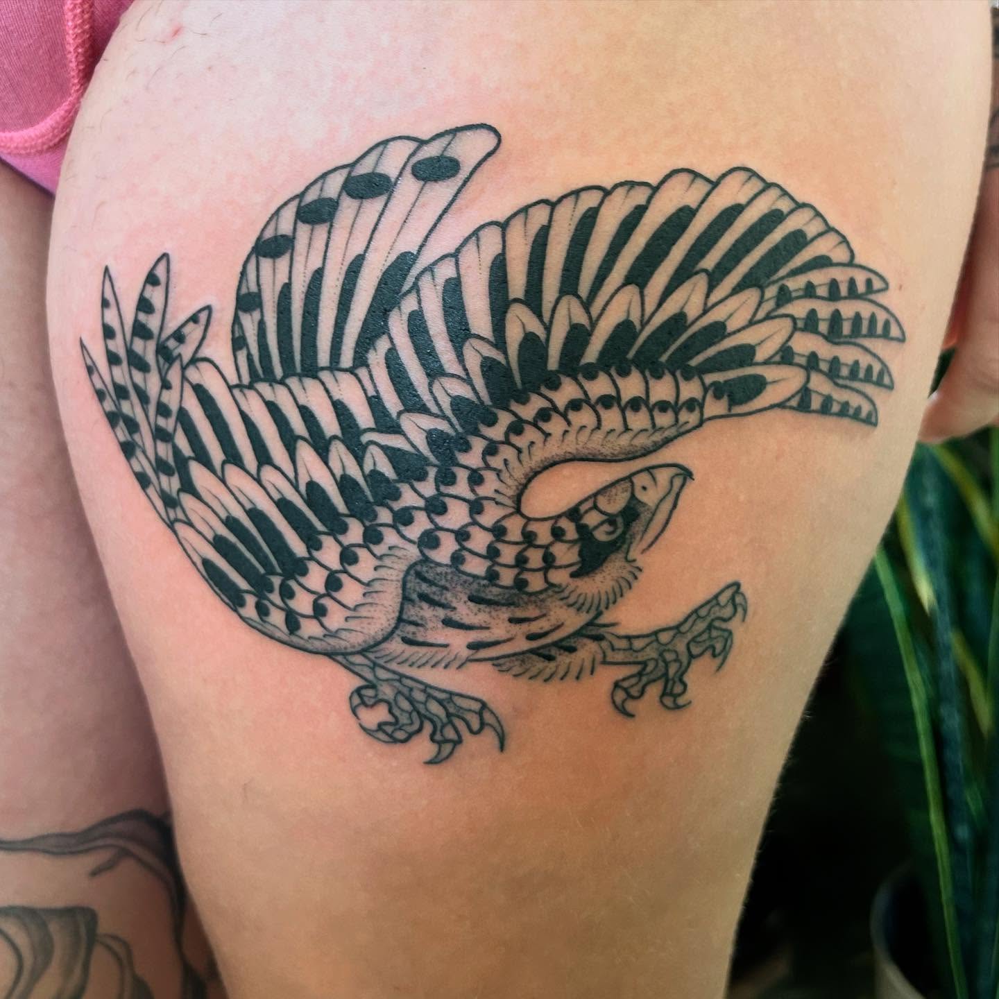 Bird black and grey tattoo on the thigh by Erica Finley