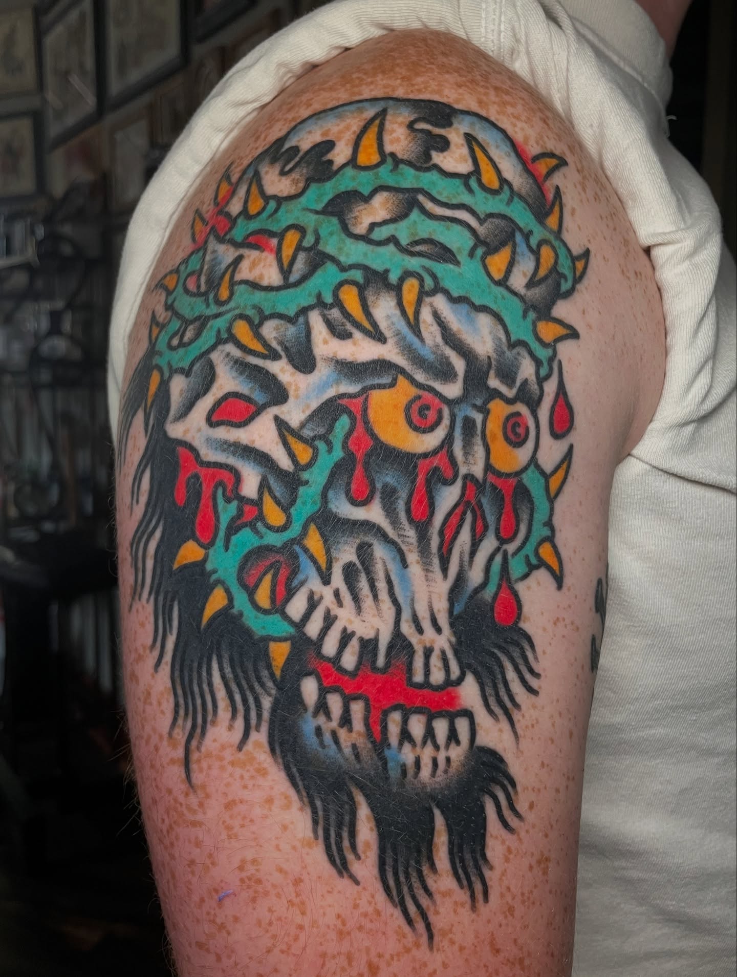 Skull American traditional tattoo on the upper arm by David Armacost, Cincinnati, Ohio