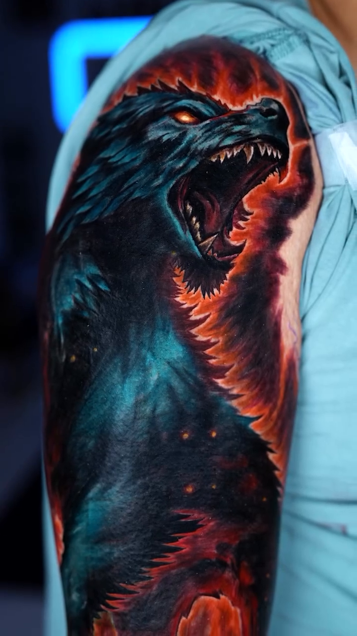 Wolf with fiery background realism tattoo by Keebs
