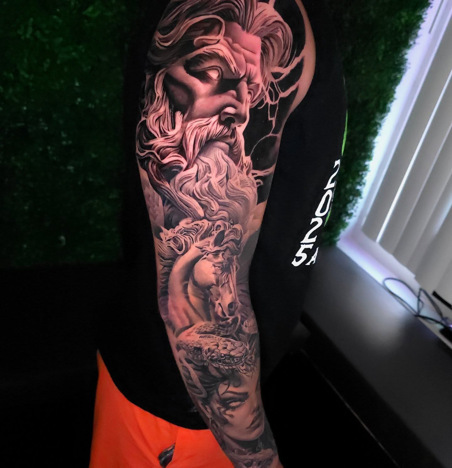 God-like figure realism tattoo on the forearm by Javier M Davila