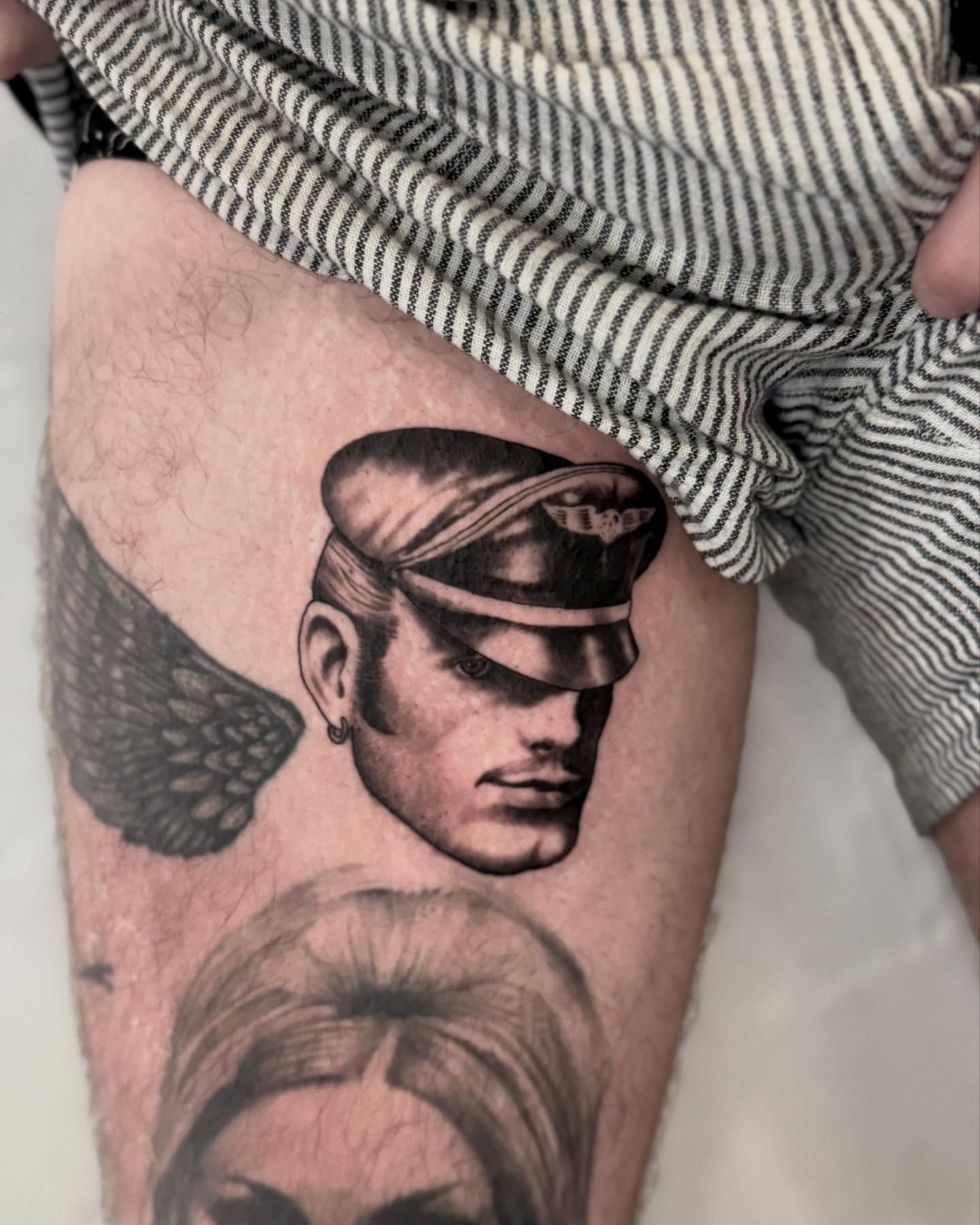 Aviator profile realism tattoo on the thigh by Drew Foster, Toledo, Ohio
