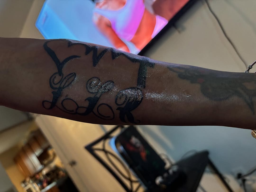 Script lettering lettering tattoo on the forearm by Family and Loyalty