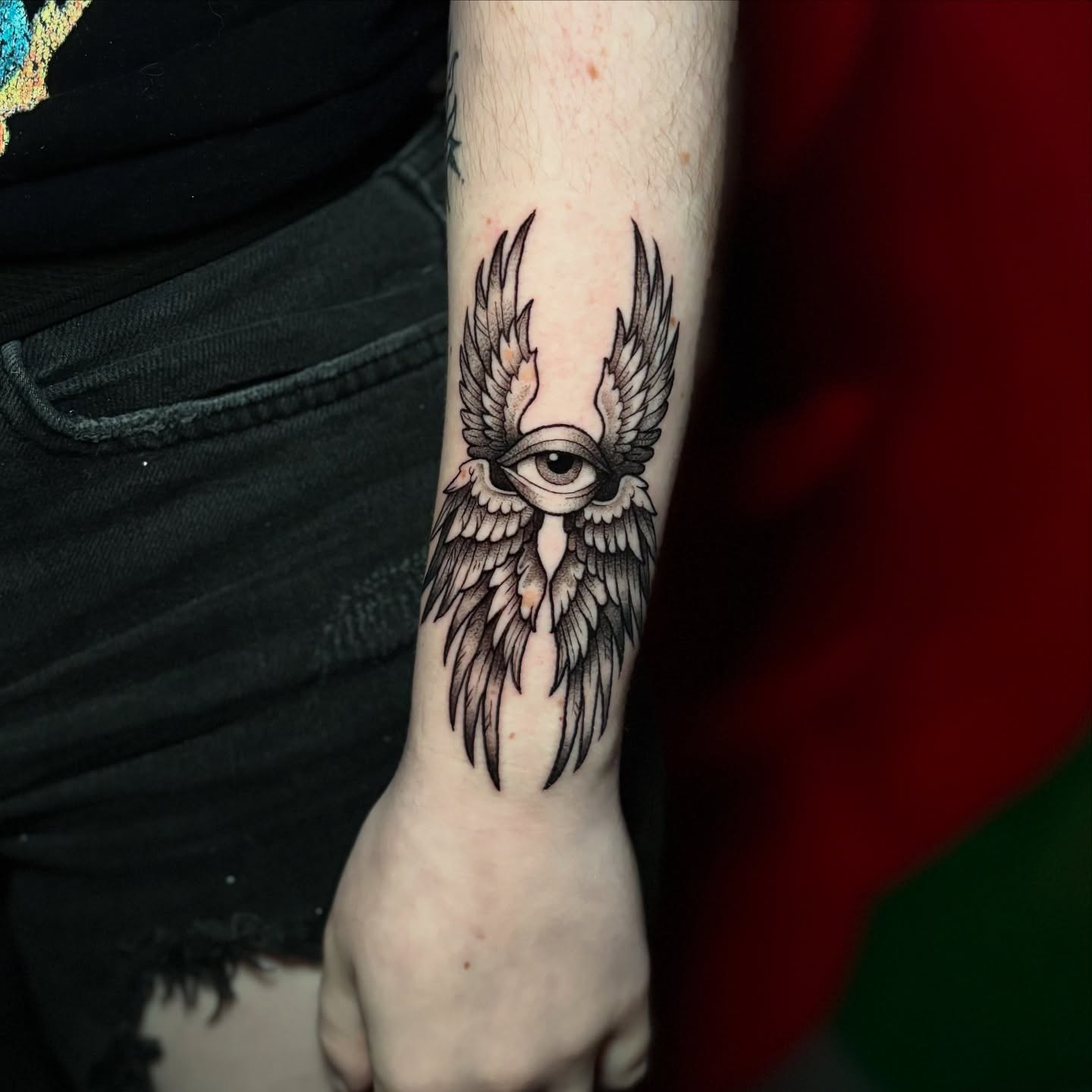 Eye with wings black and grey tattoo on the forearm by 𝕊𝕒𝕞 ☪︎ ִ ࣪𖤐 𐦍 ☾𖤓