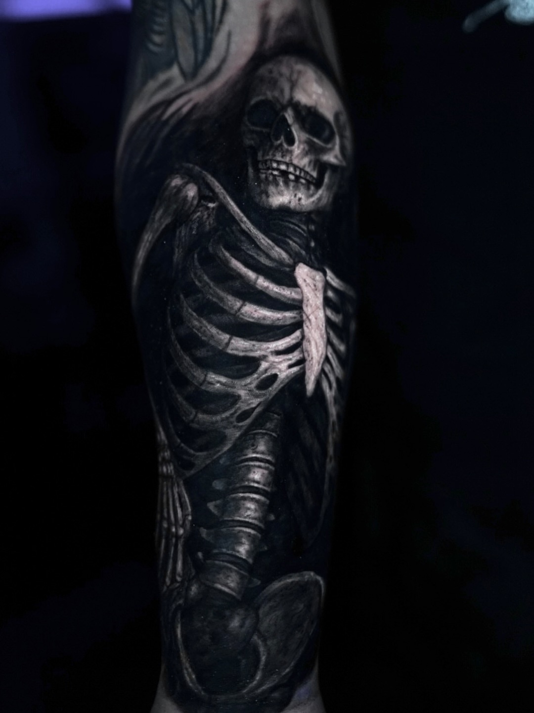 Skeleton realism tattoo on the forearm by Devin Mullen