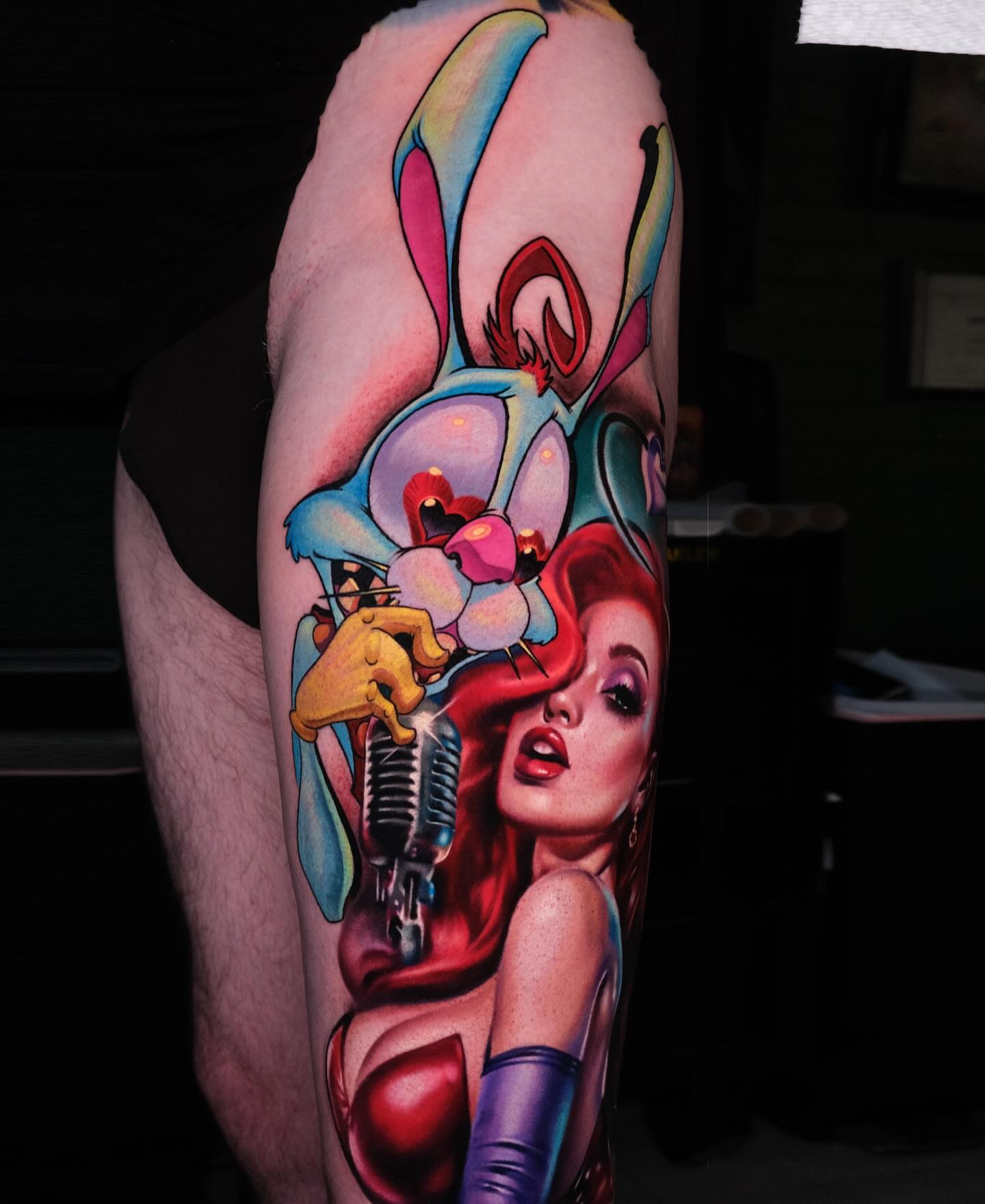 Anime-style rabbit and woman illustrative tattoo on the forearm by Jesse Smith