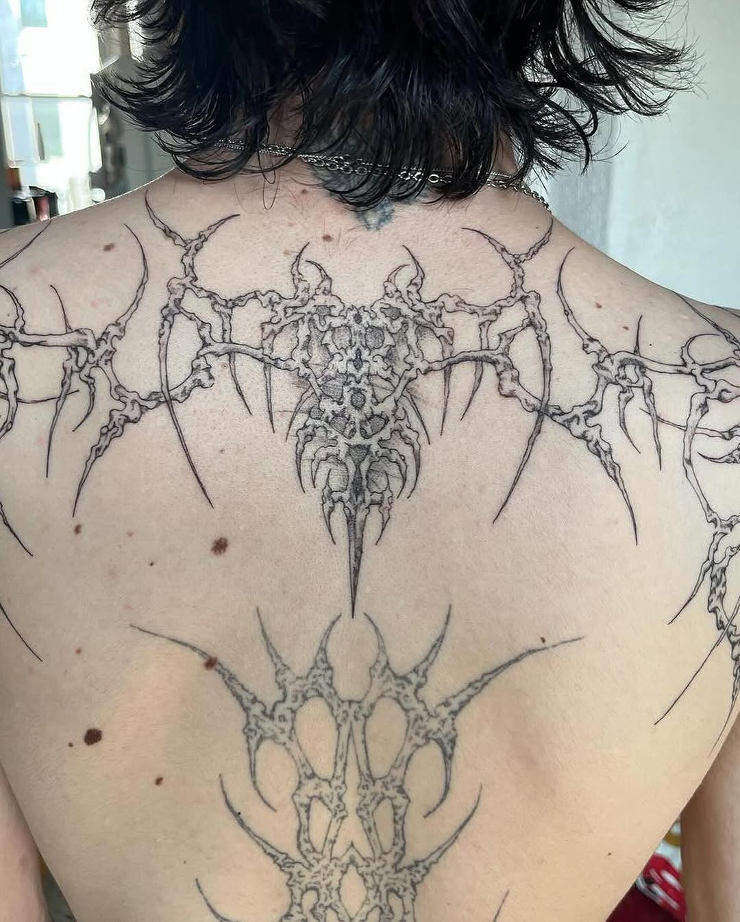 Abstract organic forms cyber sigilism tattoo on the back by @initiationoftorture