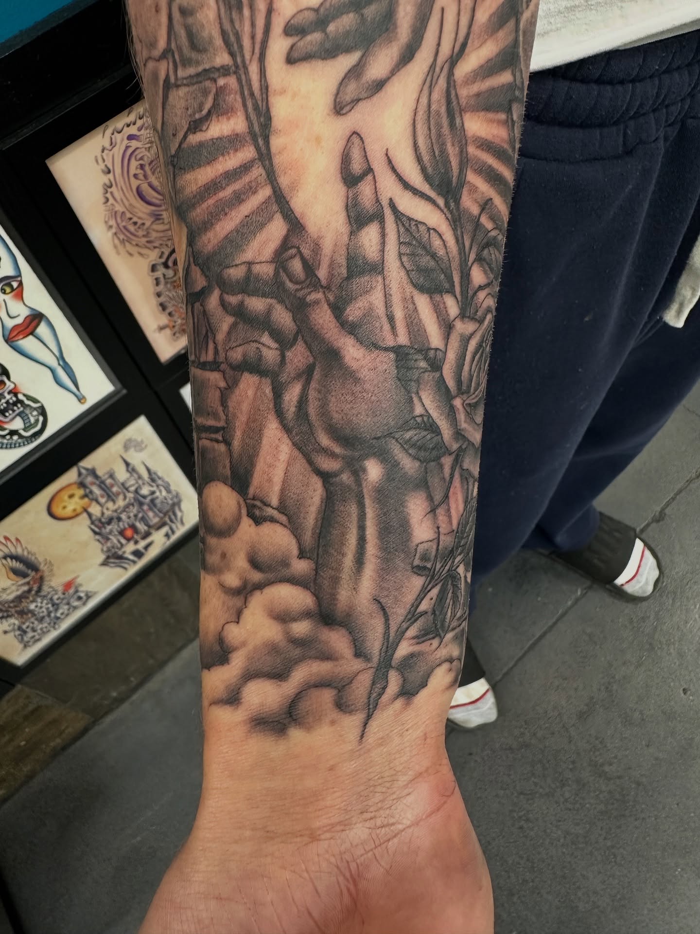 Hands and roses realism tattoo on the forearm by Stevie O'Dell